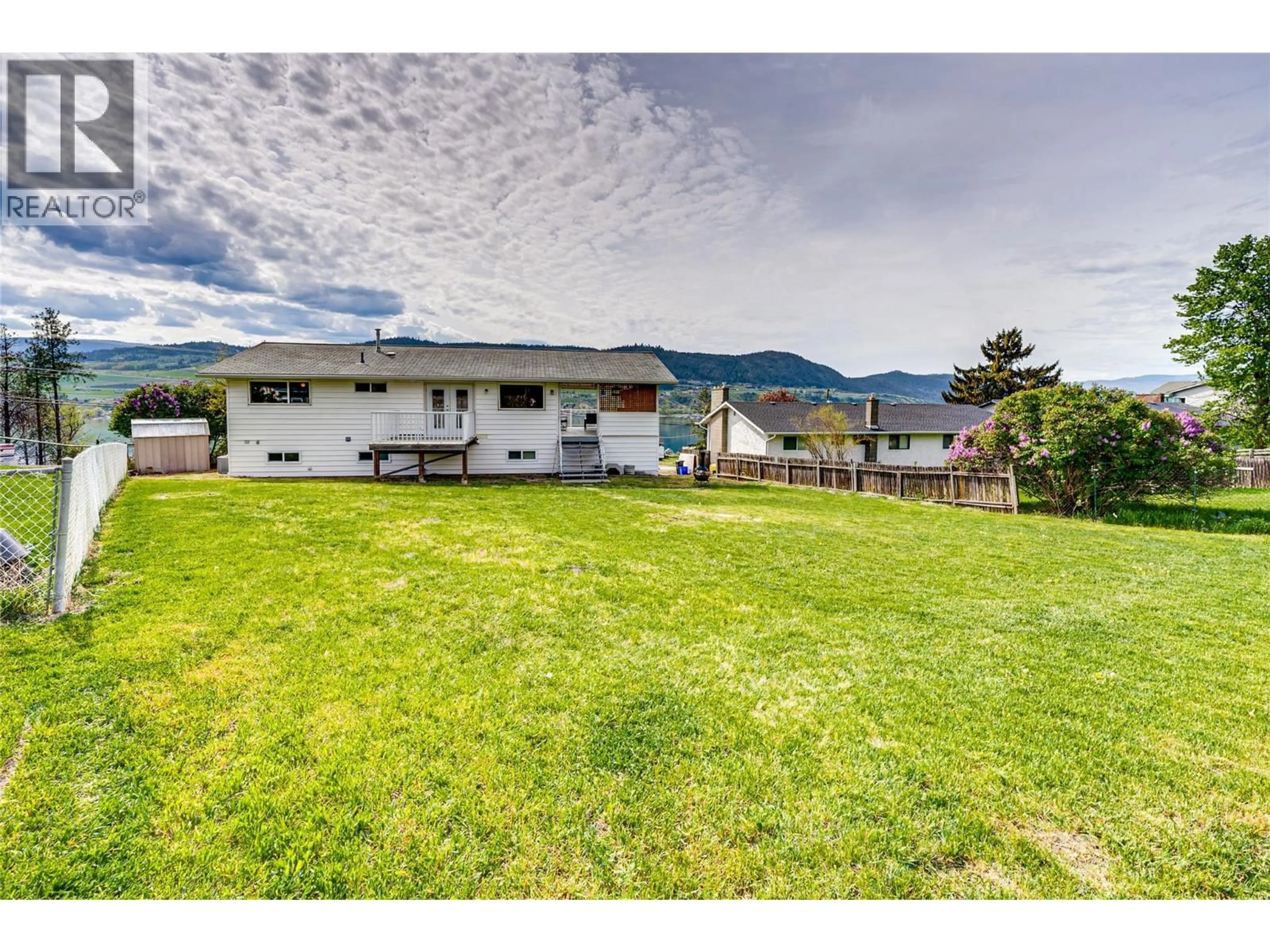 A pic from outside/outdoor area/front of a property/back of a property/a pic from drone, mountain view for 7415 TRONSON ROAD, Vernon British Columbia V1H1S4