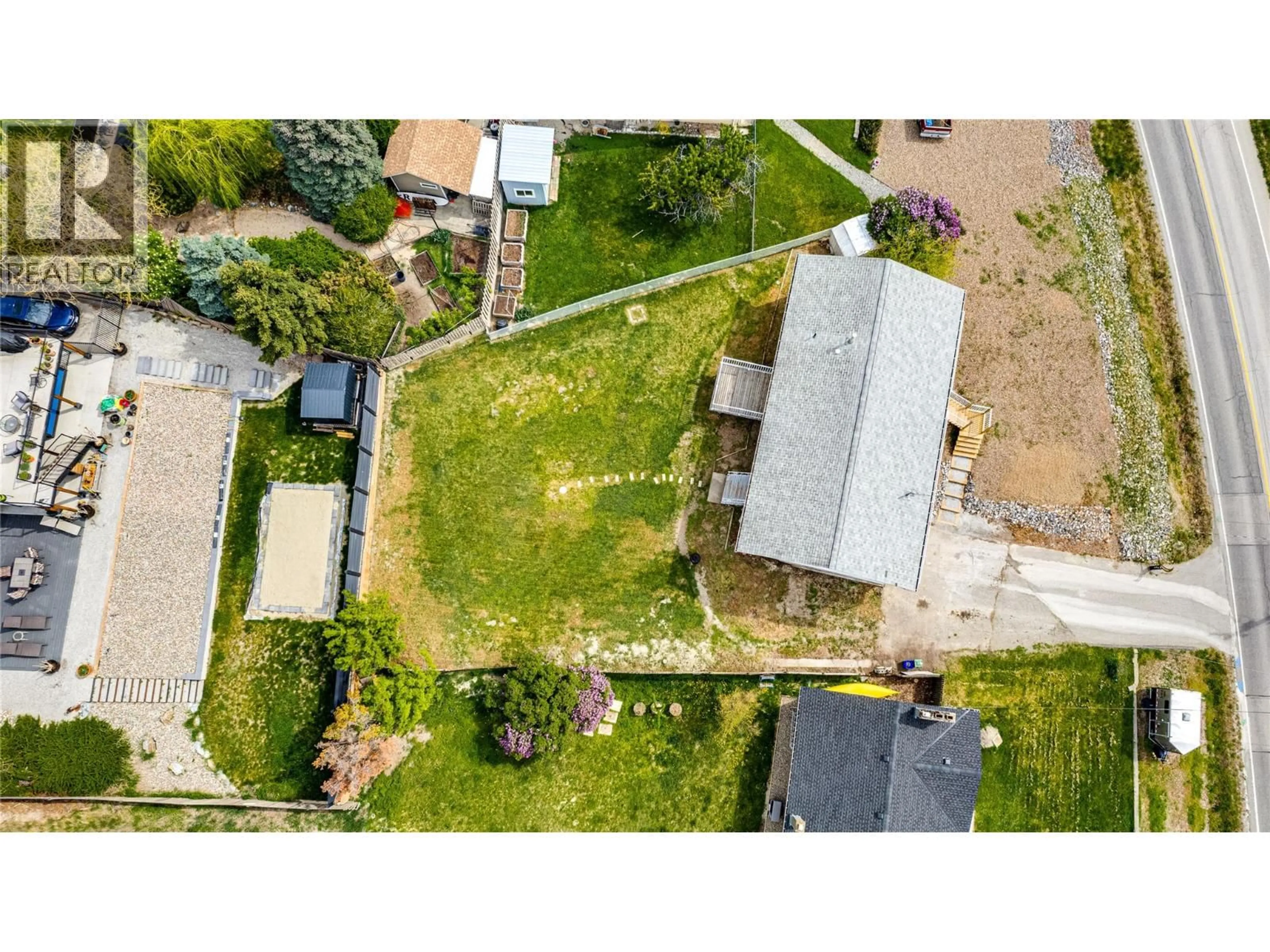 A pic from outside/outdoor area/front of a property/back of a property/a pic from drone, street for 7415 TRONSON ROAD, Vernon British Columbia V1H1S4