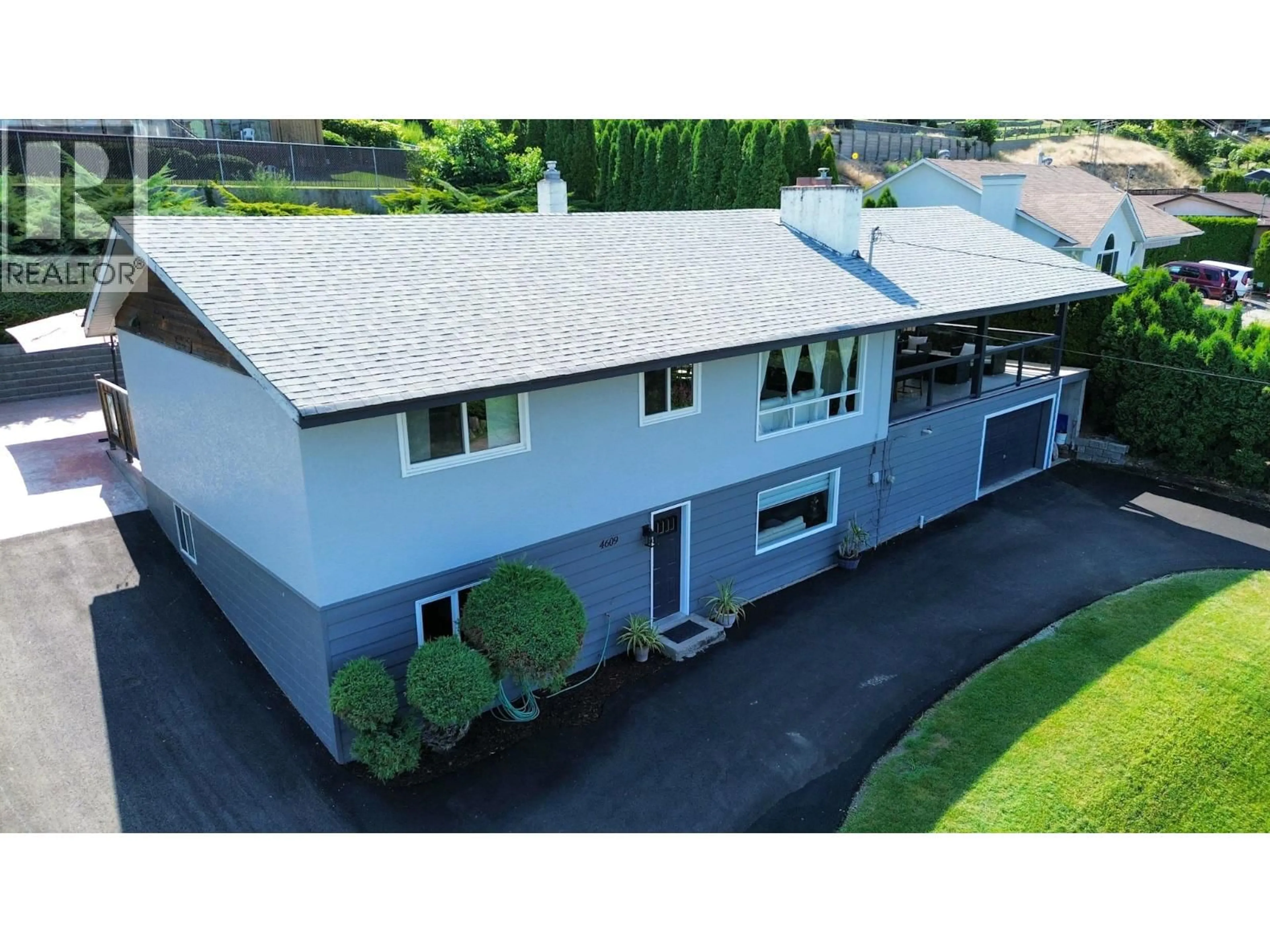 A pic from outside/outdoor area/front of a property/back of a property/a pic from drone, street for 4609 41ST STREET, Osoyoos British Columbia V0H1V6