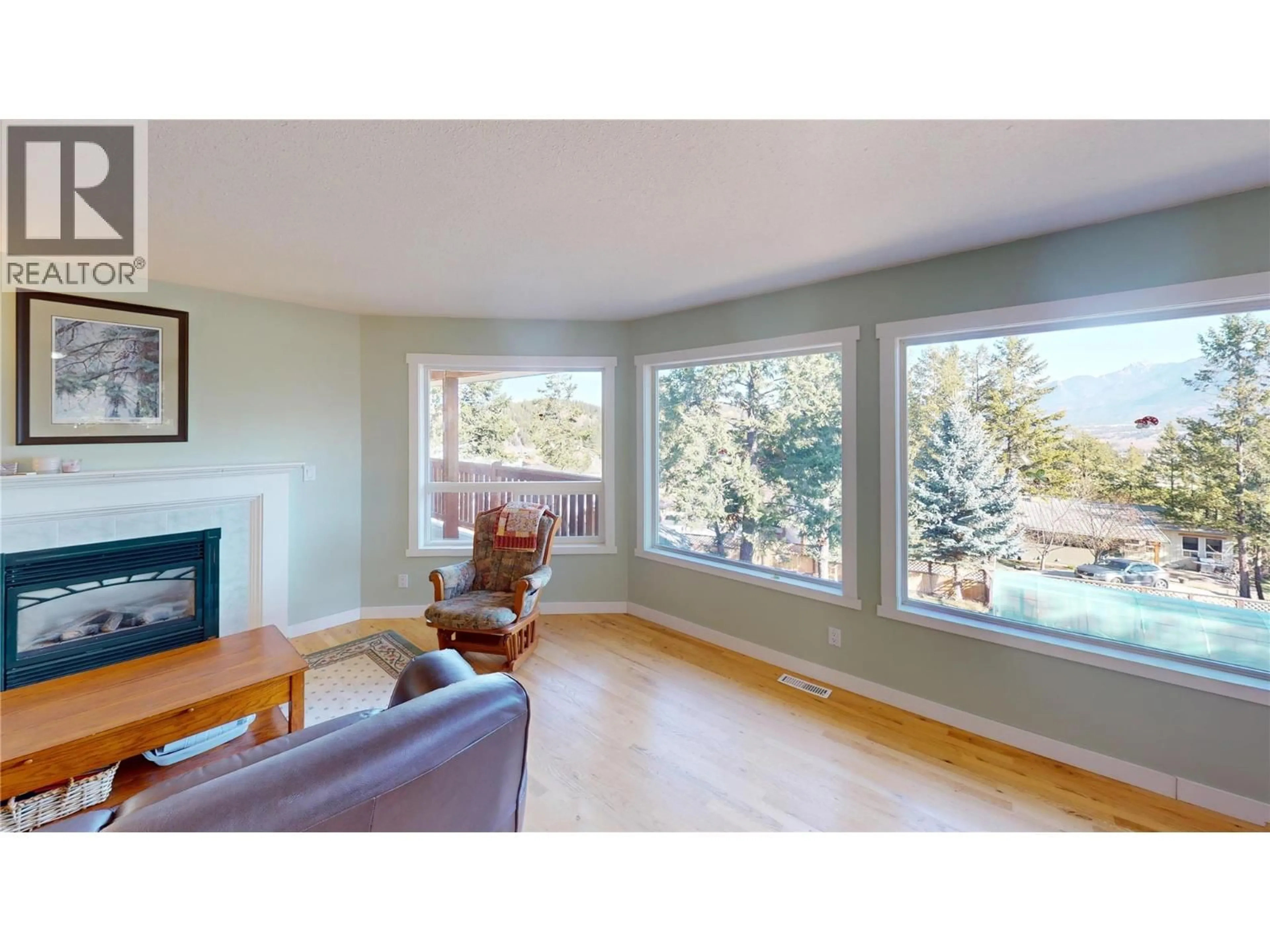 Living room with furniture, wood/laminate floor for 304 WESTRIDGE PLACE, Invermere British Columbia V0A1K4