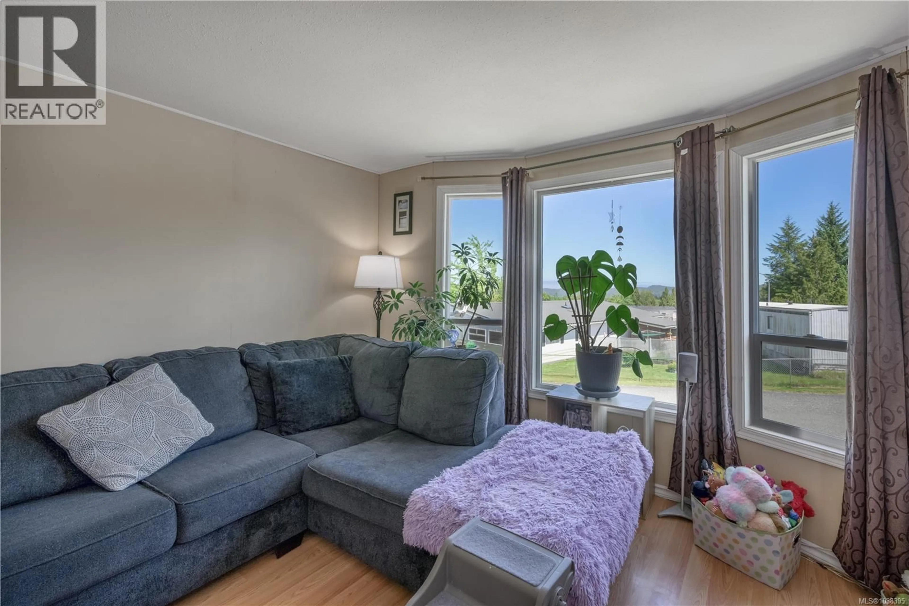 Living room with furniture, unknown for 7296 TEAKERNE DRIVE, Port Hardy British Columbia V0N2P0