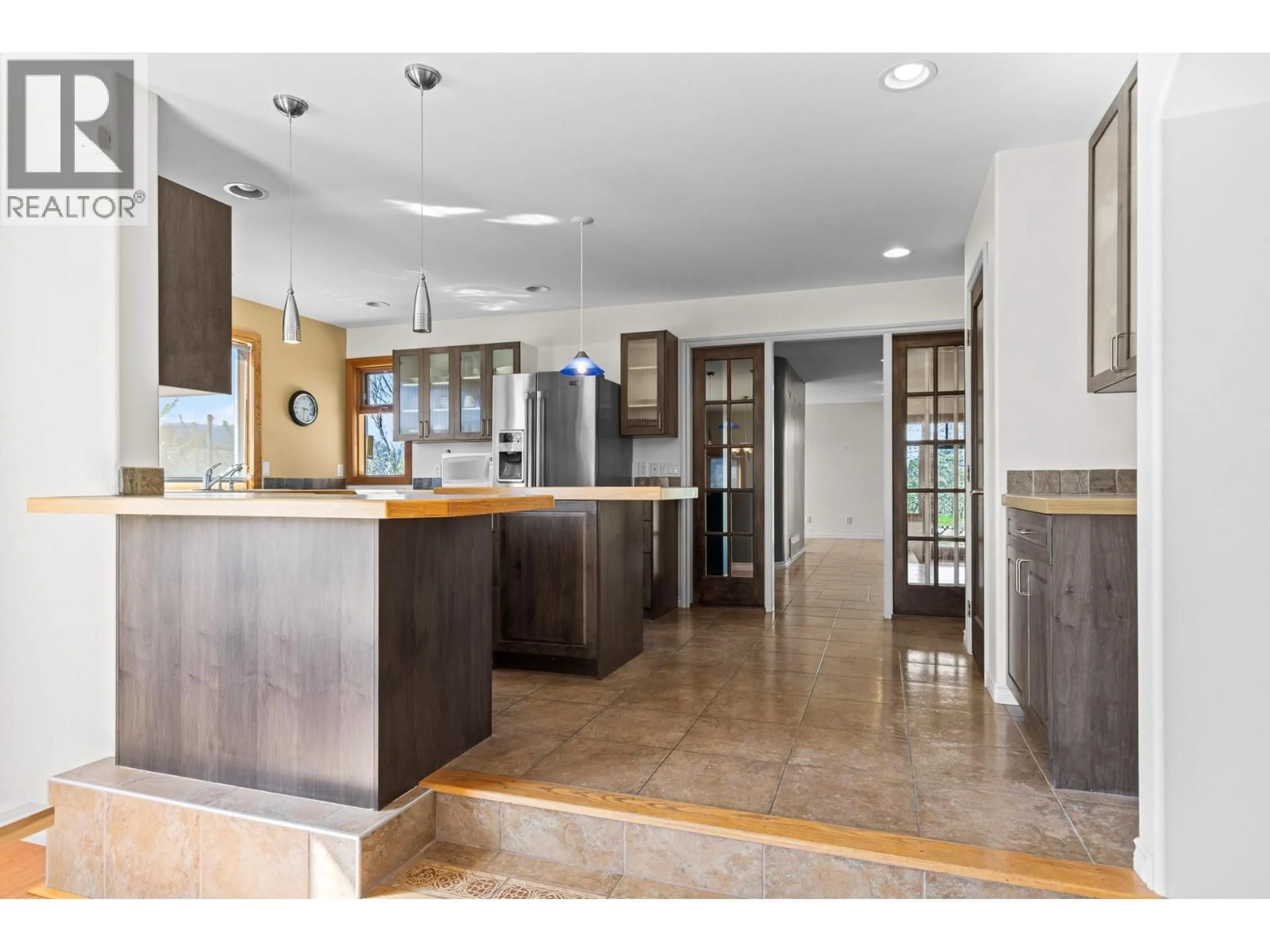 Open concept kitchen, ceramic/tile floor for 3547 BEMROSE ROAD, Kelowna British Columbia V1W4G8