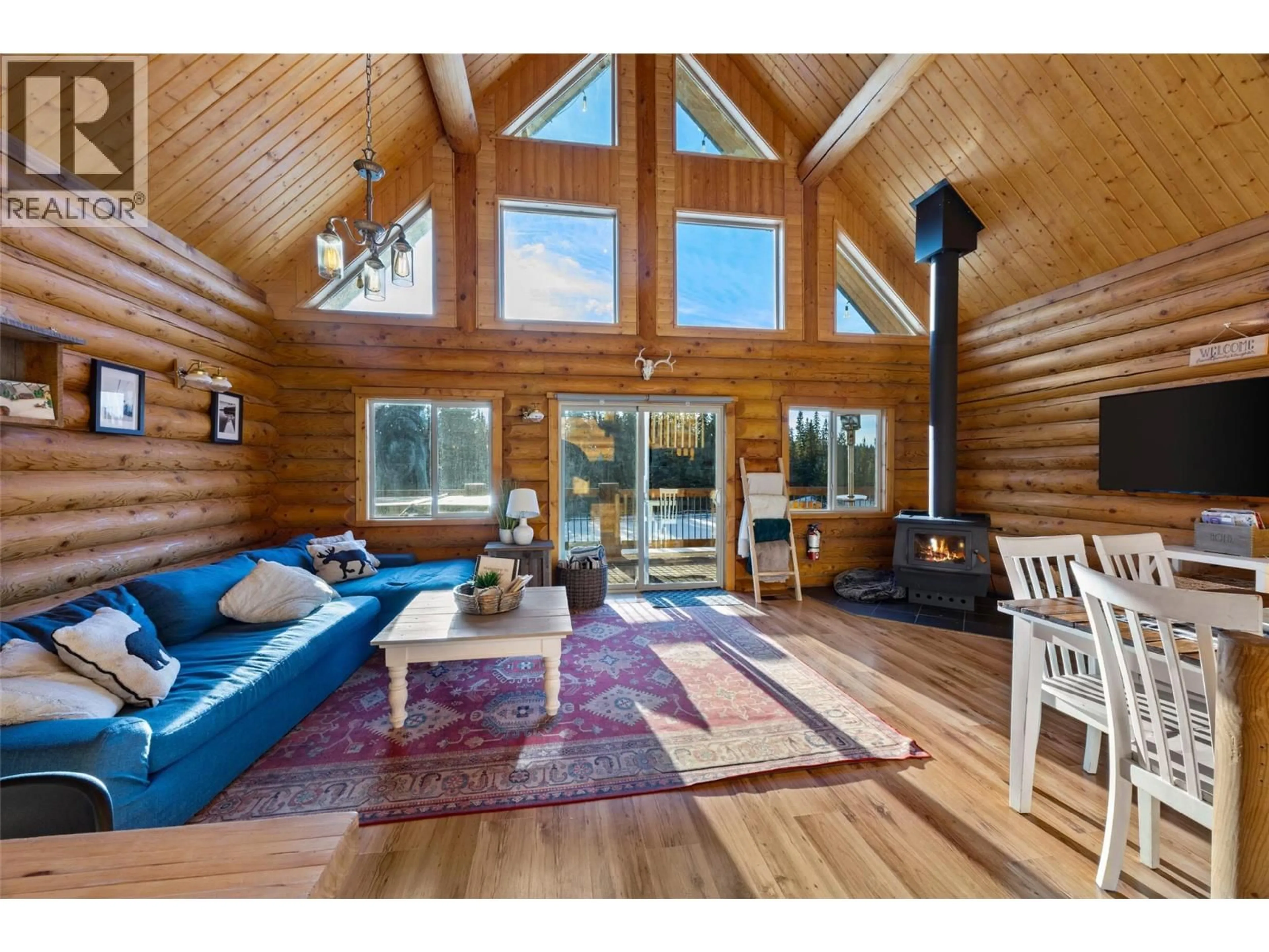 Living room with furniture, wood/laminate floor for 4889 PINE RIDGE WAY, Logan Lake British Columbia V0E1W0