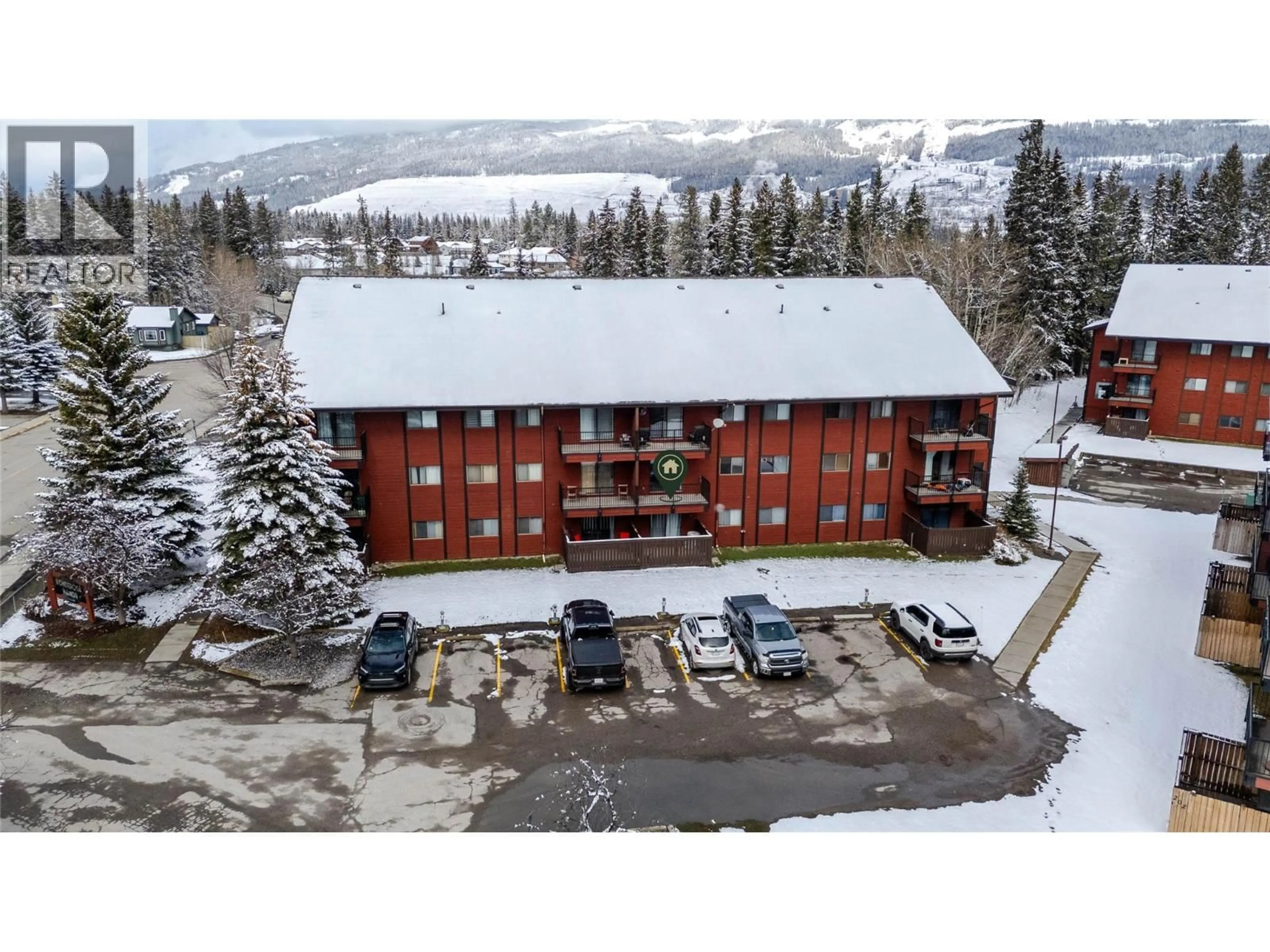 A pic from outside/outdoor area/front of a property/back of a property/a pic from drone, mountain view for 114A - 1286 PONDEROSA DRIVE, Sparwood British Columbia V0B2G2
