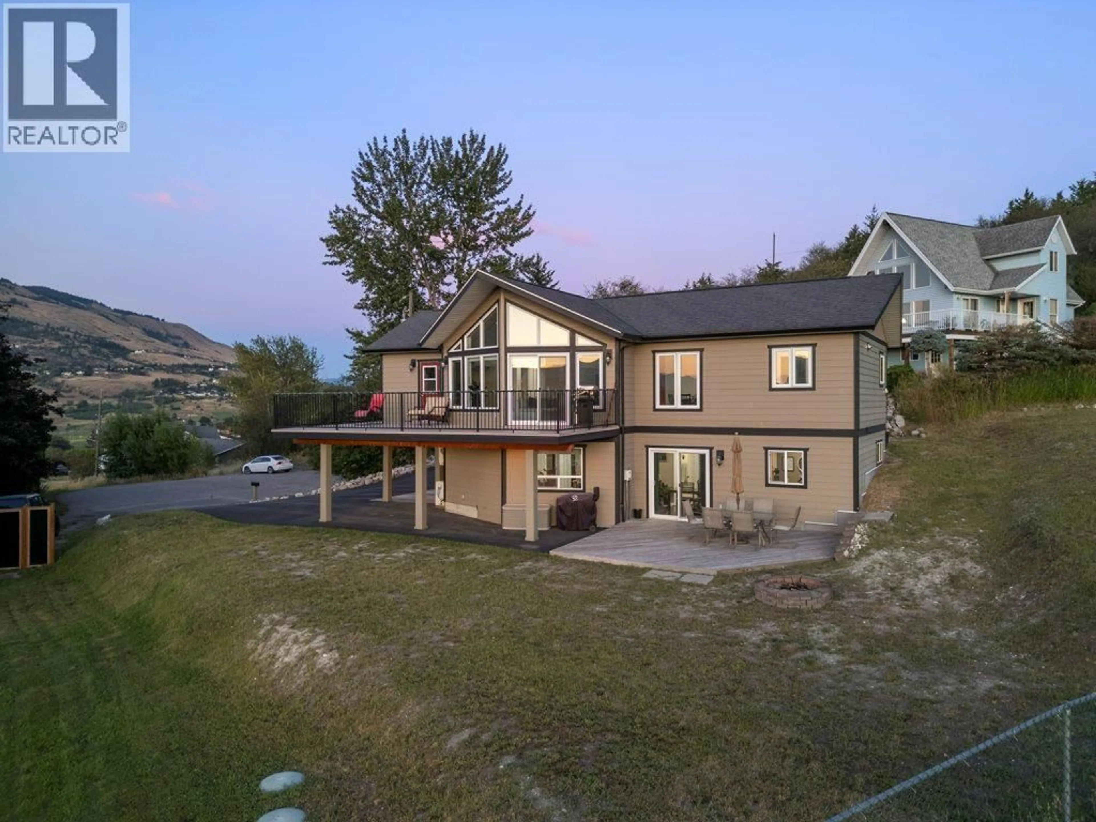 A pic from outside/outdoor area/front of a property/back of a property/a pic from drone, water/lake/river/ocean view for 148 FENWICK ROAD, Vernon British Columbia V1B2V6