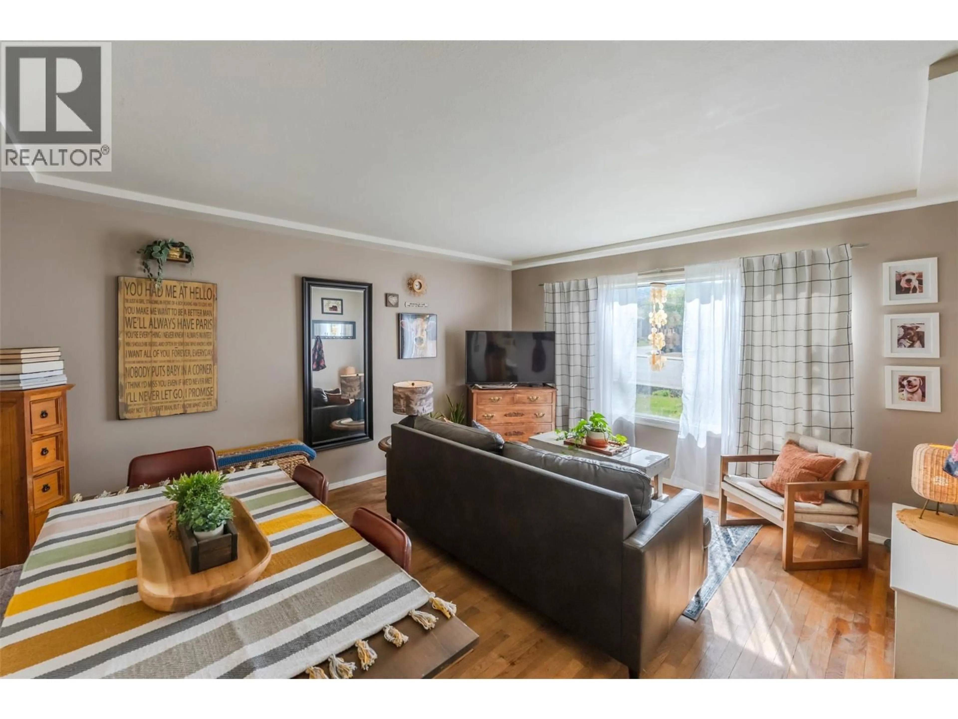 Living room with furniture, wood/laminate floor for 797 FORESTBROOK DRIVE, Penticton British Columbia V2A2E6