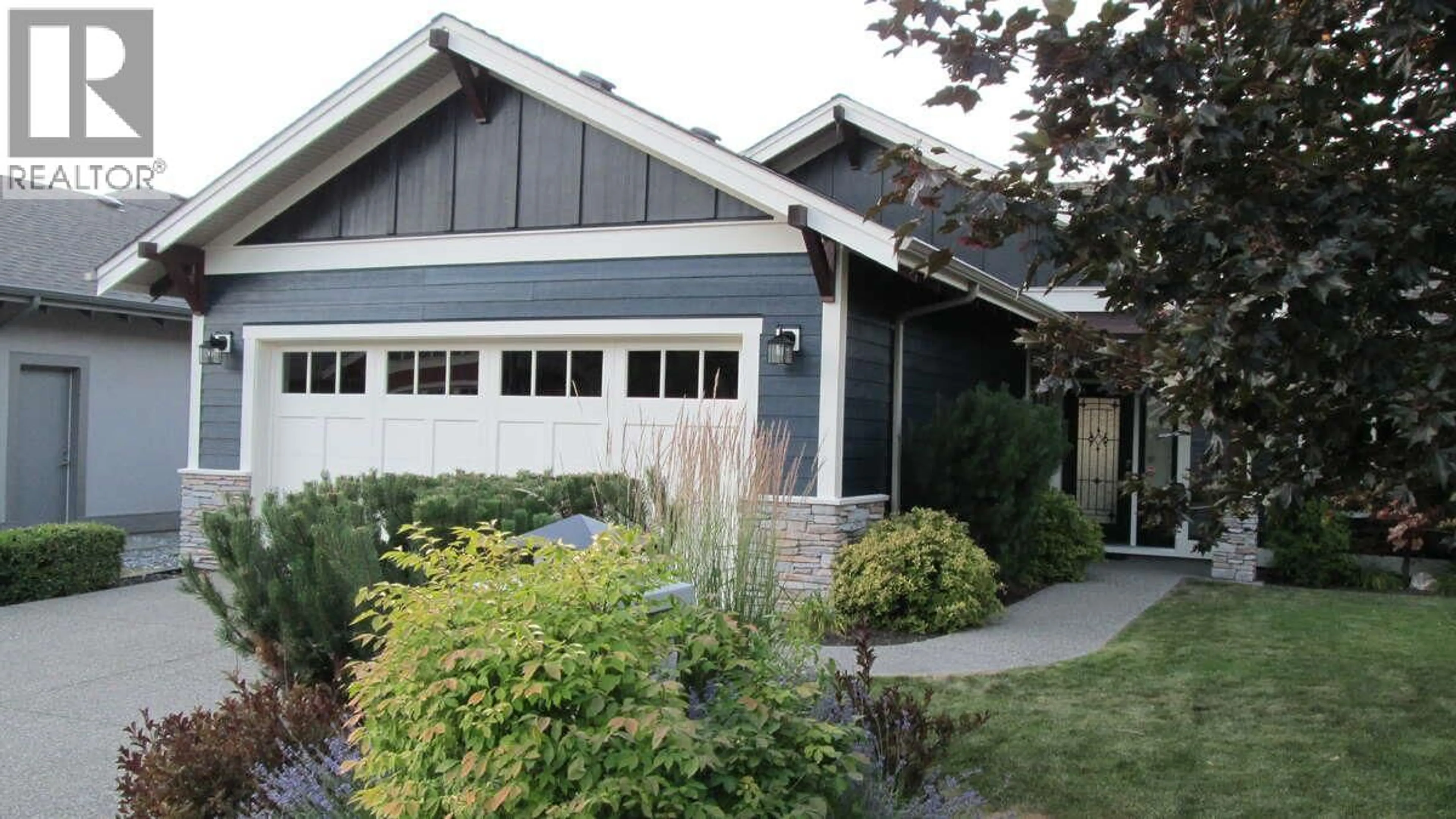 Home with vinyl exterior material, street for 501 LONGSPOON BAY, Vernon British Columbia V1H2K2