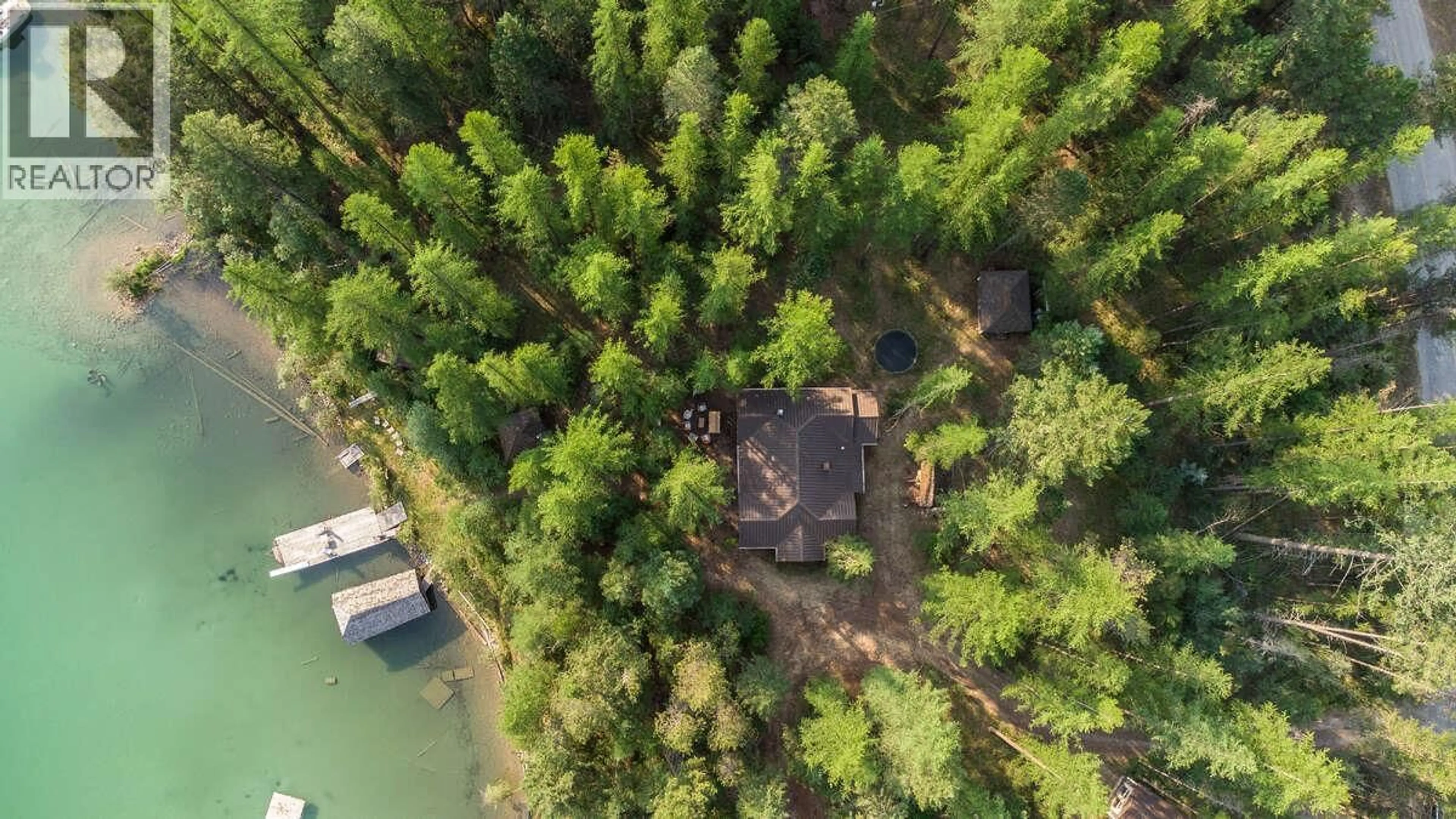 A pic from outside/outdoor area/front of a property/back of a property/a pic from drone, forest/trees view for 6768 ROSEN LAKE ROAD, Jaffray British Columbia V0B1T1