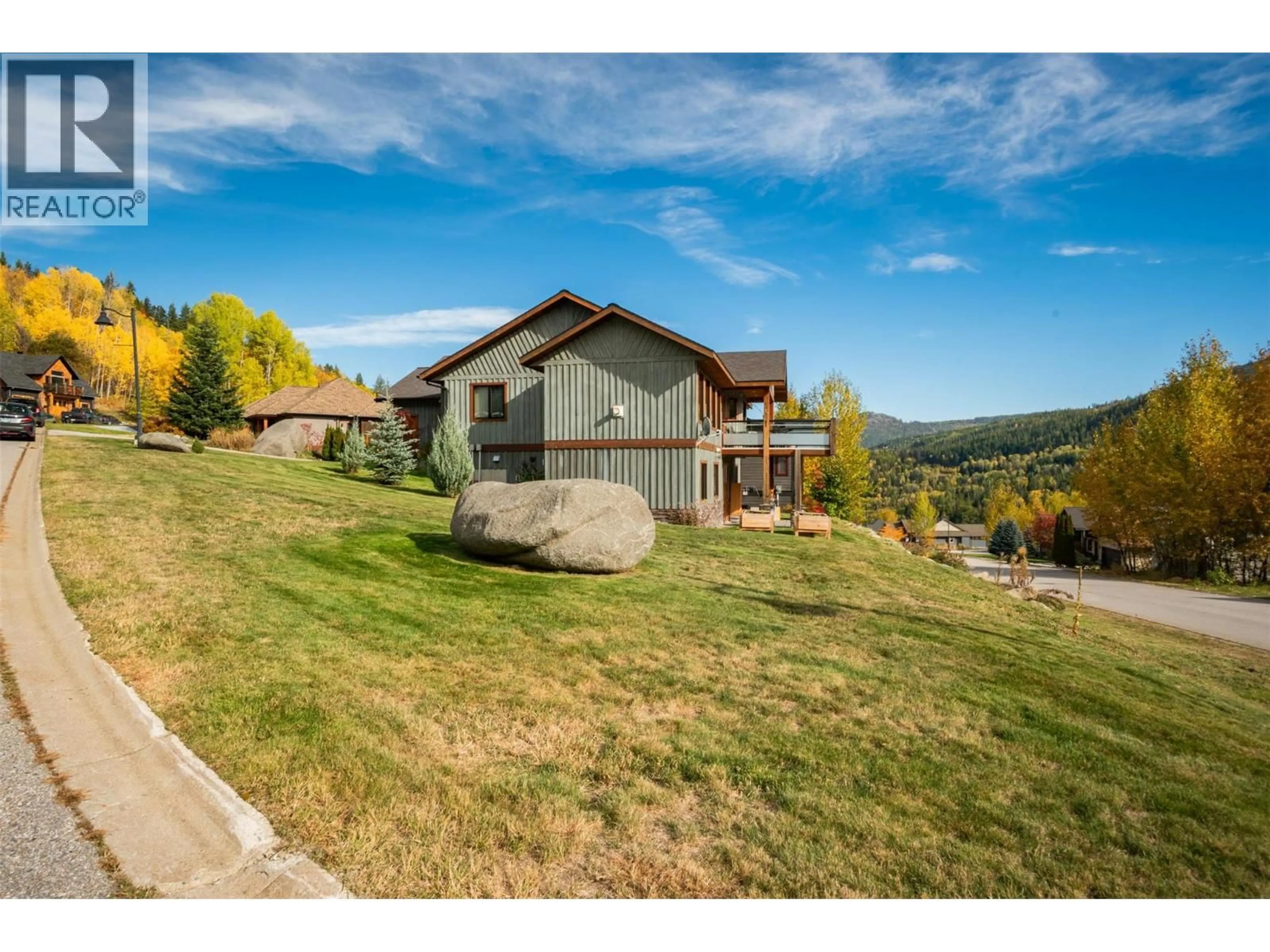A pic from outside/outdoor area/front of a property/back of a property/a pic from drone, mountain view for 904 REDSTONE DRIVE, Rossland British Columbia V0G1Y0
