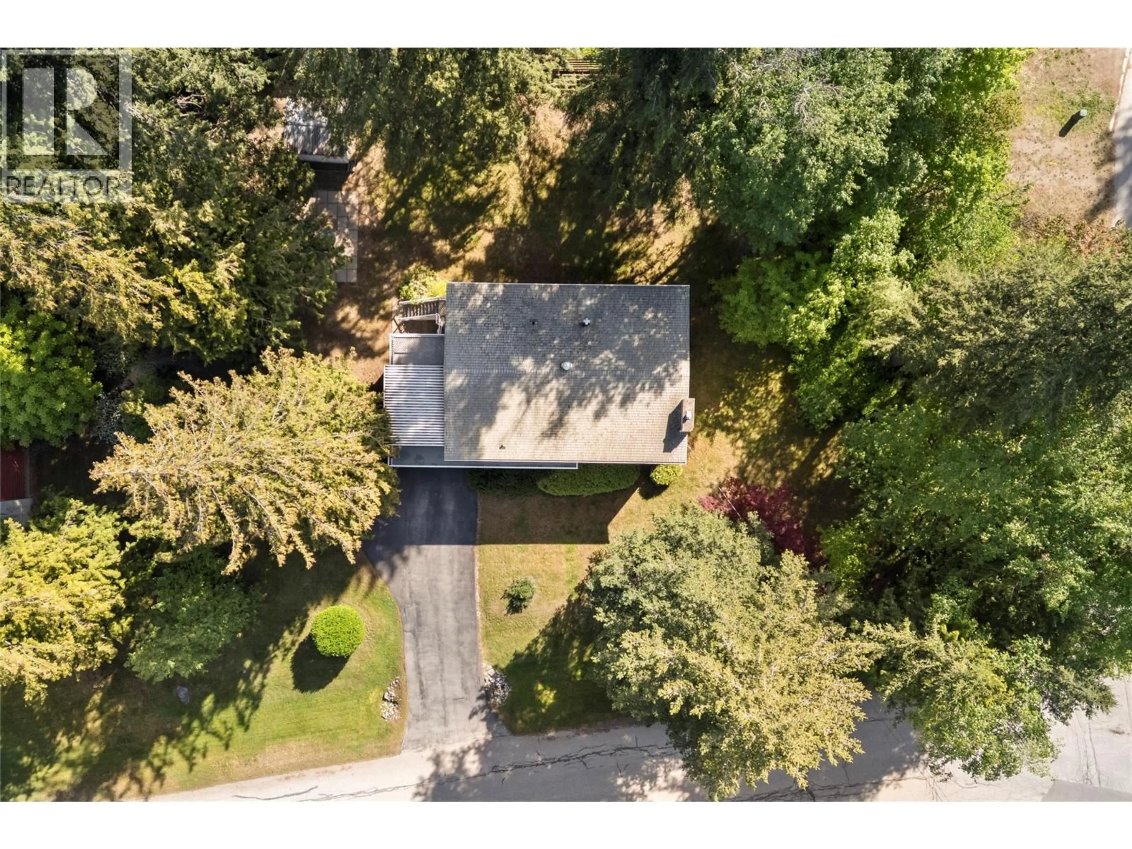A pic from outside/outdoor area/front of a property/back of a property/a pic from drone, forest/trees view for 170 25TH STREET NORTHEAST, Salmon Arm British Columbia V1E2A8
