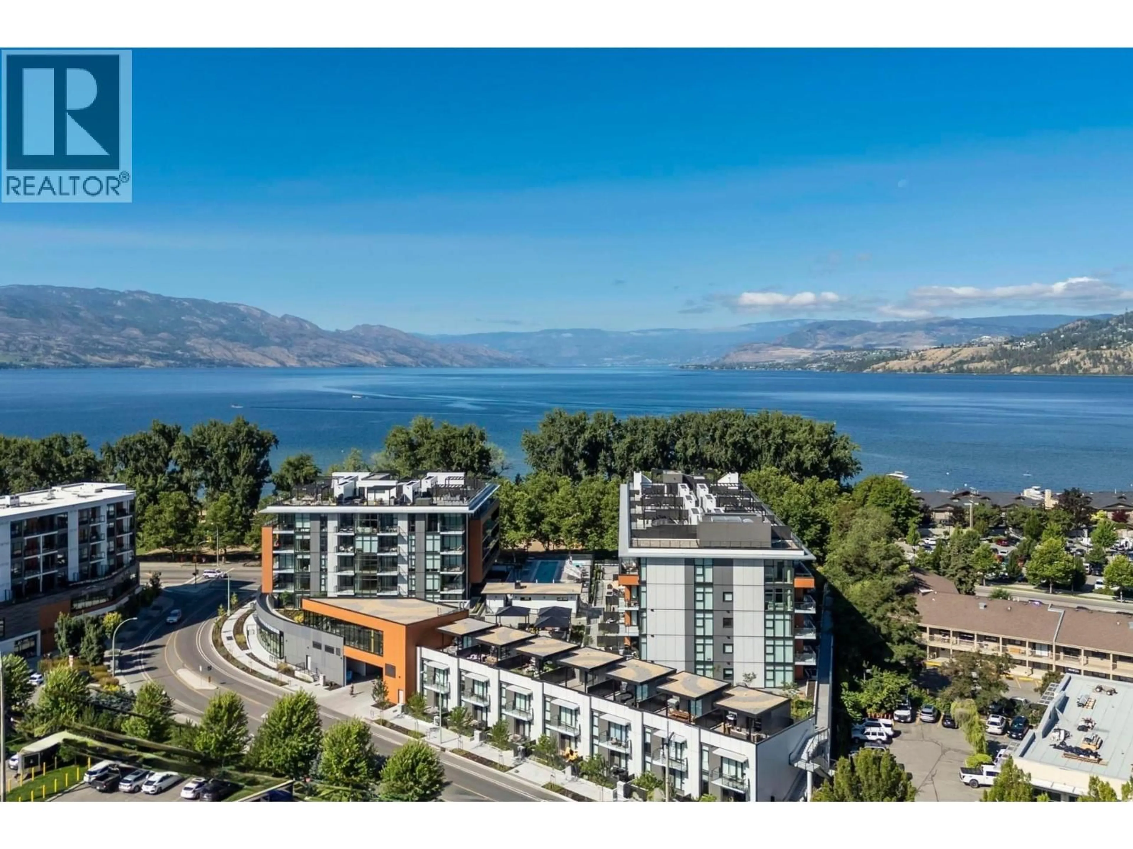 A pic from outside/outdoor area/front of a property/back of a property/a pic from drone, water/lake/river/ocean view for 303 - 3409 LAKESHORE ROAD, Kelowna British Columbia V1W0G6