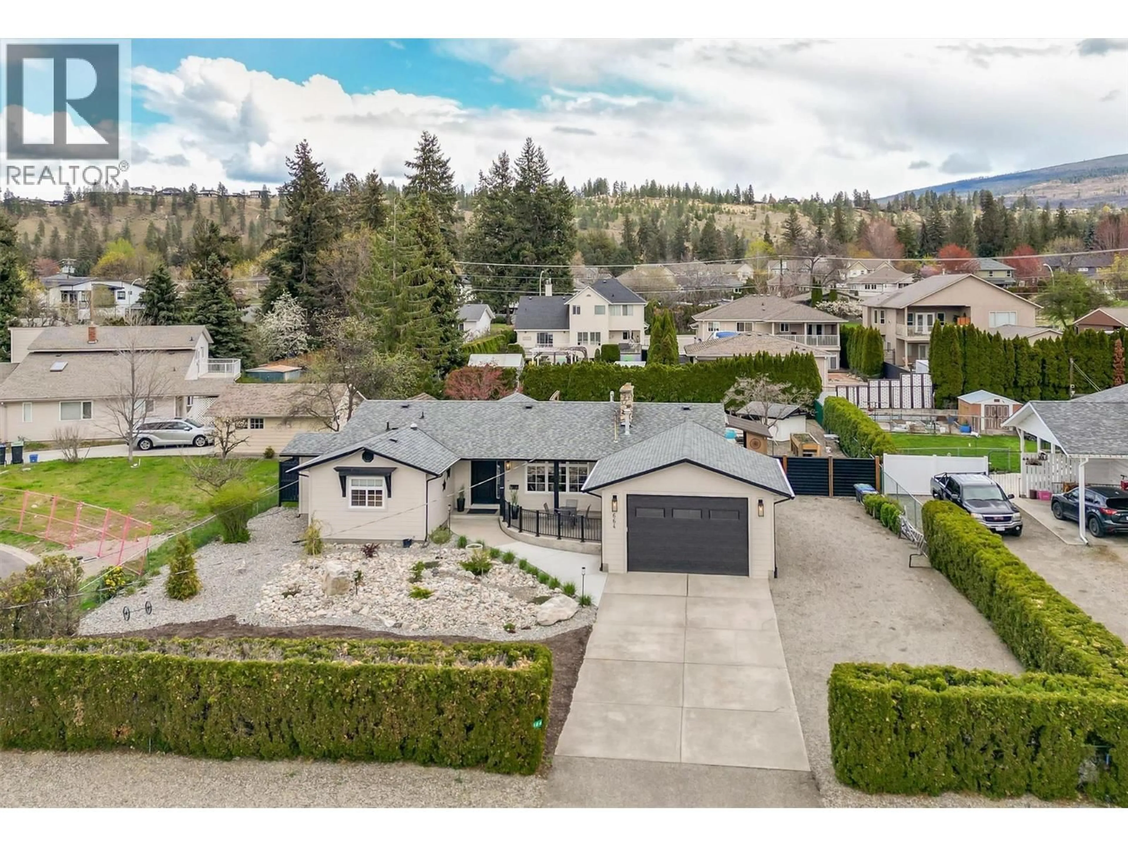 A pic from outside/outdoor area/front of a property/back of a property/a pic from drone, mountain view for 664 BERK COURT, Kelowna British Columbia V1W1T9