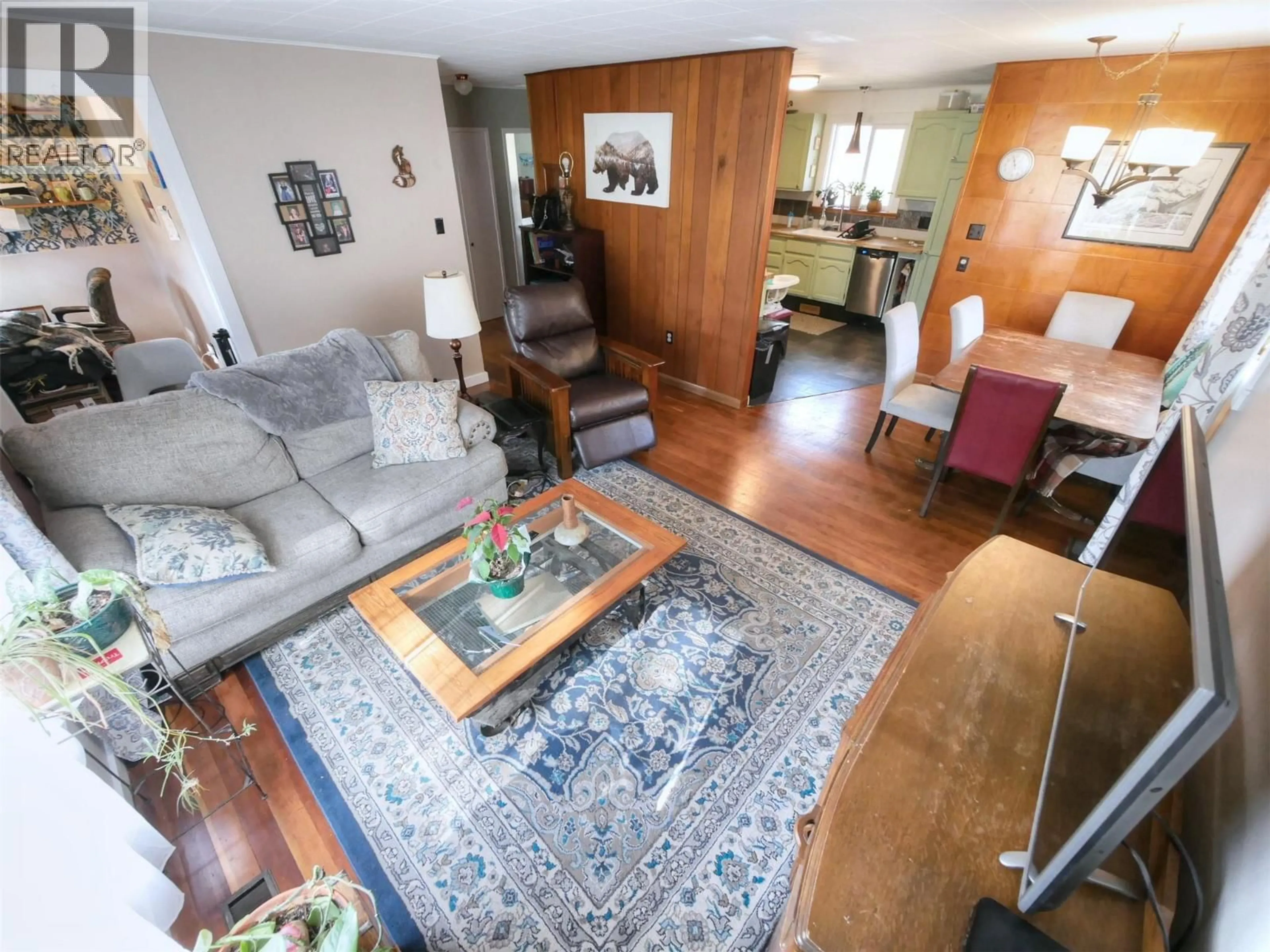 Living room with furniture, wood/laminate floor for 819 GLEN DRIVE, Trail British Columbia V1R1B5