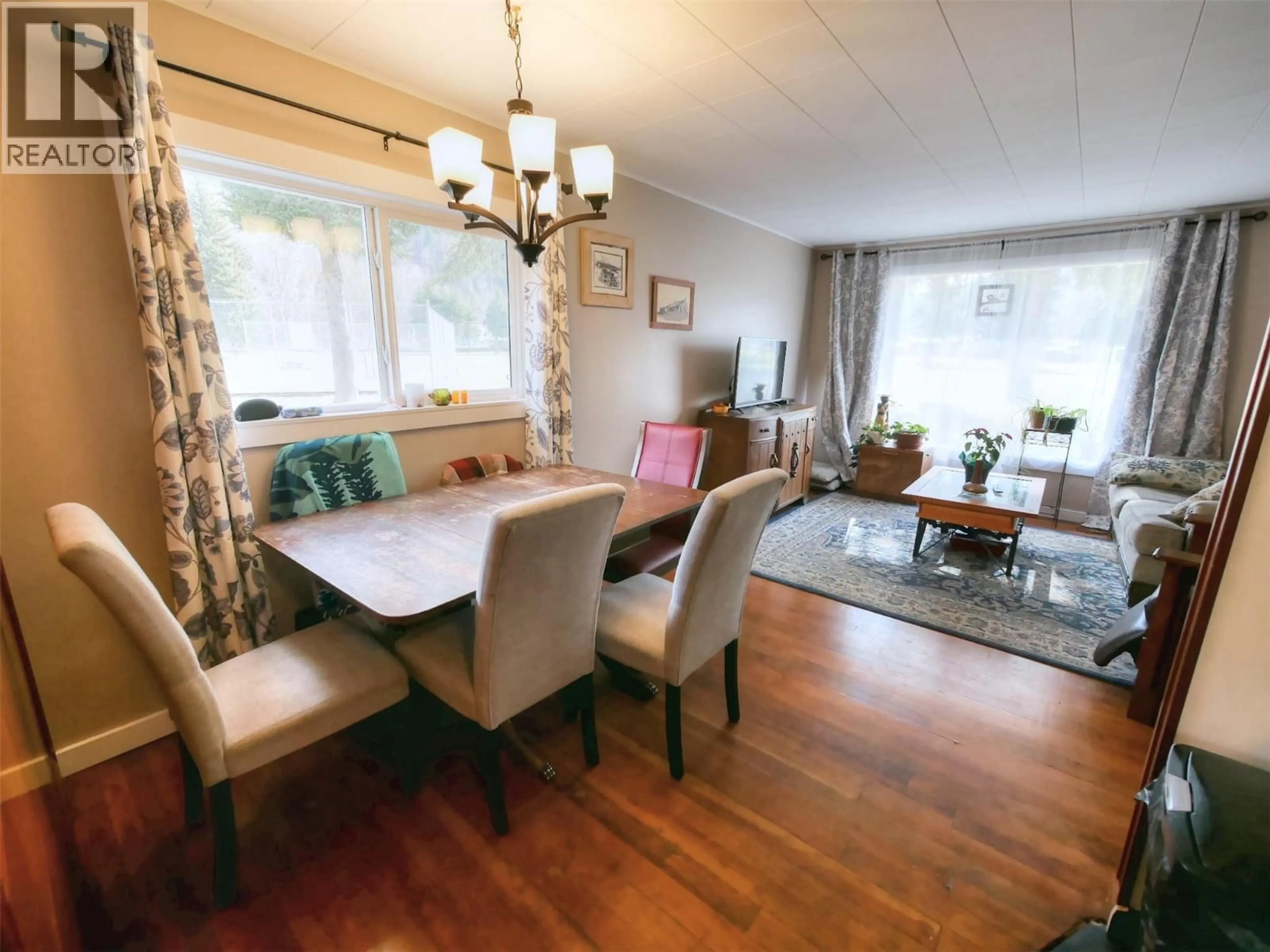 Living room with furniture, wood/laminate floor for 819 GLEN DRIVE, Trail British Columbia V1R1B5