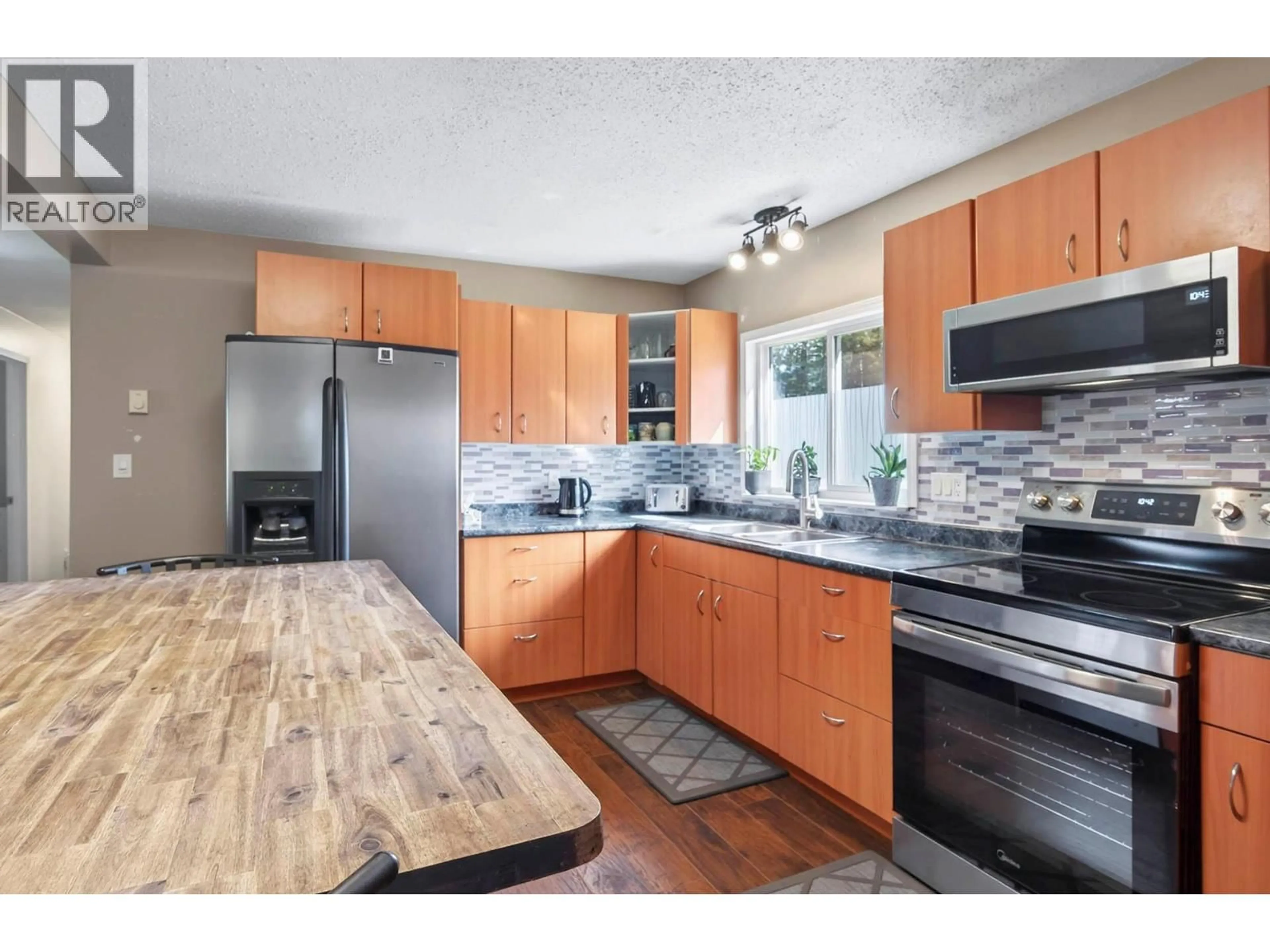 Open concept kitchen, wood/laminate floor for 115 NORFOLK ROAD, Clearwater British Columbia V0E1N1