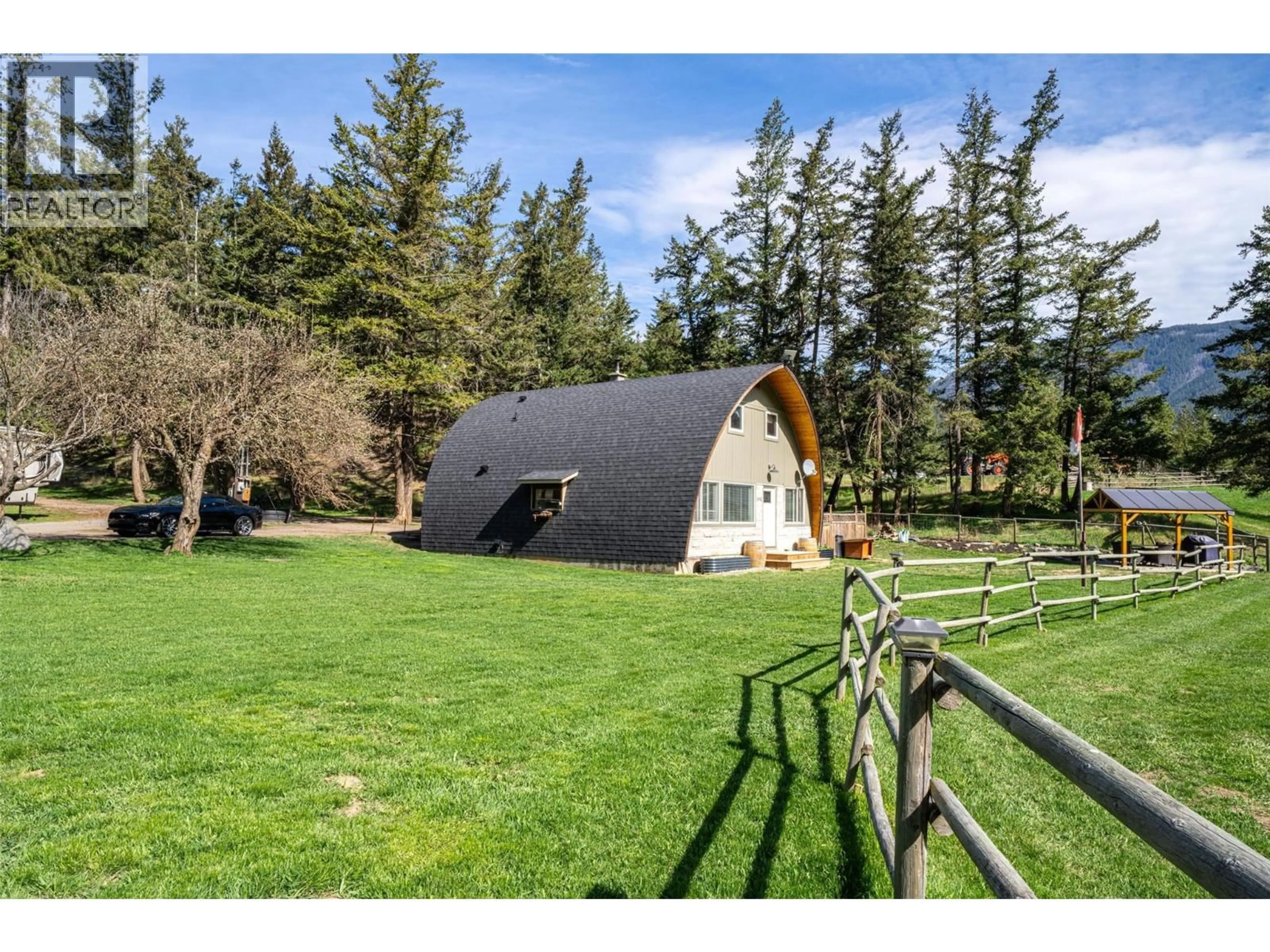 A pic from outside/outdoor area/front of a property/back of a property/a pic from drone, mountain view for 6142 FALKLAND ROAD, Falkland British Columbia V0E1W0