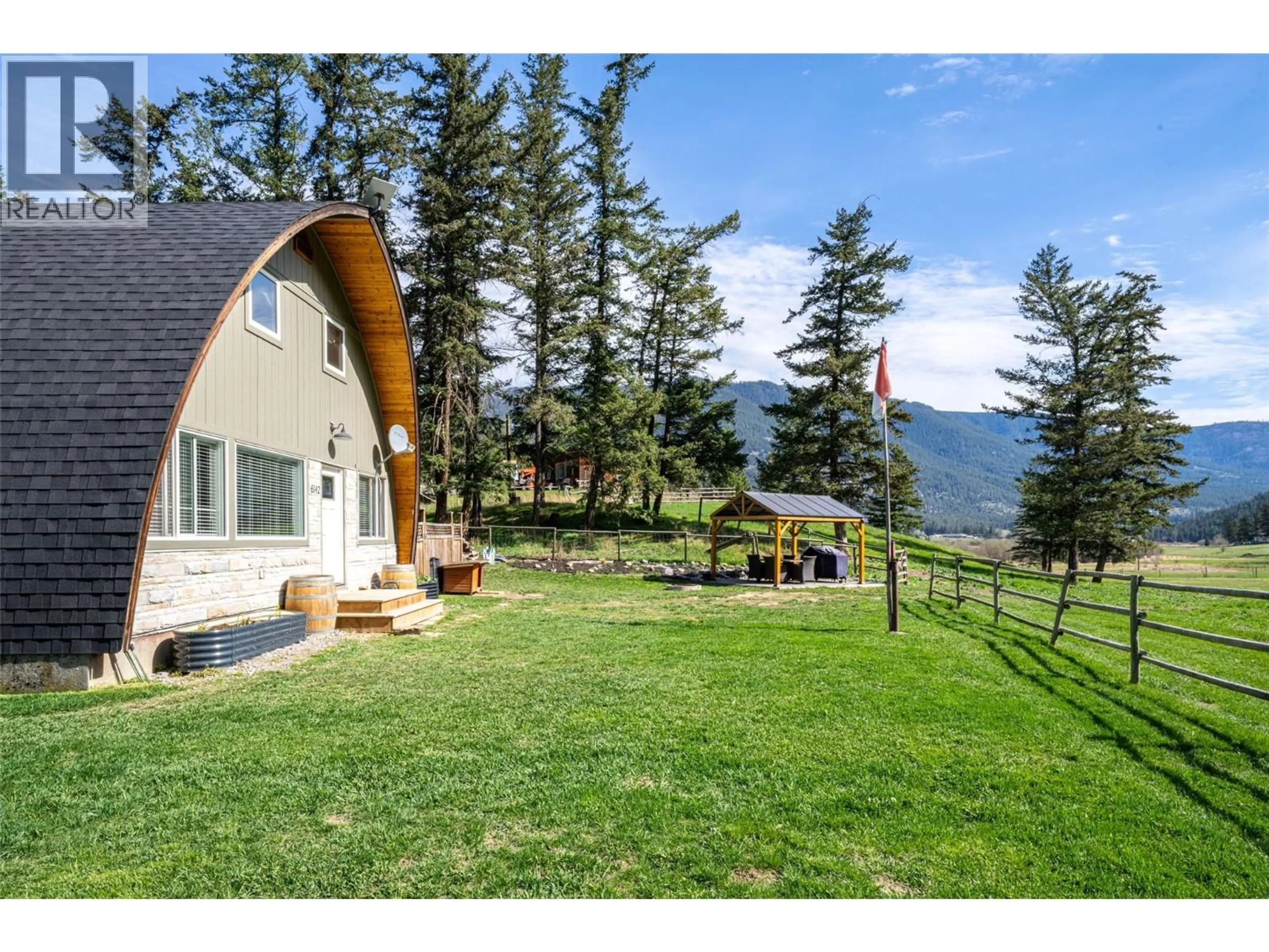 A pic from outside/outdoor area/front of a property/back of a property/a pic from drone, mountain view for 6142 FALKLAND ROAD, Falkland British Columbia V0E1W0