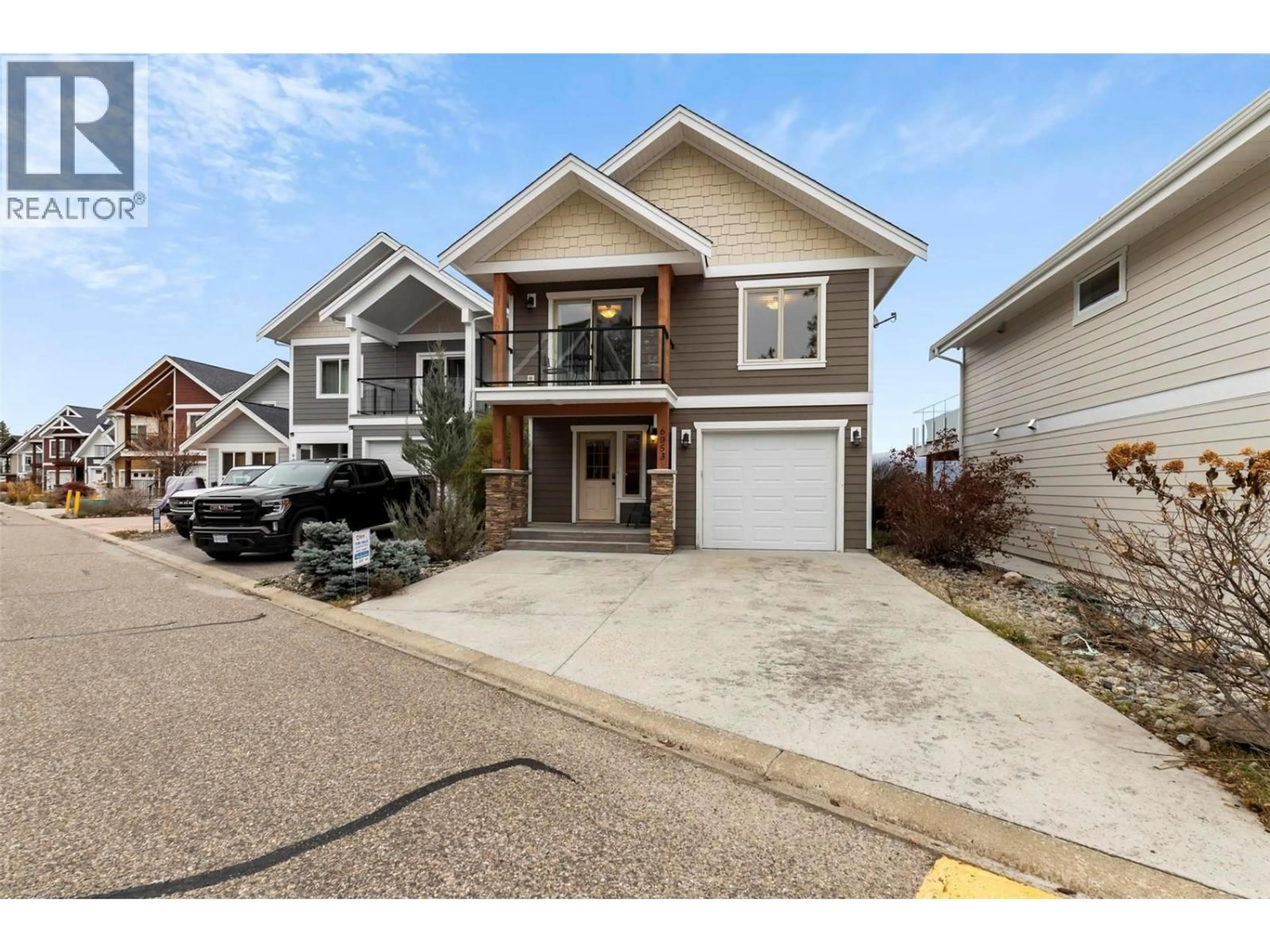 Home with vinyl exterior material, street for 6953 TERAZONA DRIVE, Kelowna British Columbia V1Z3R8