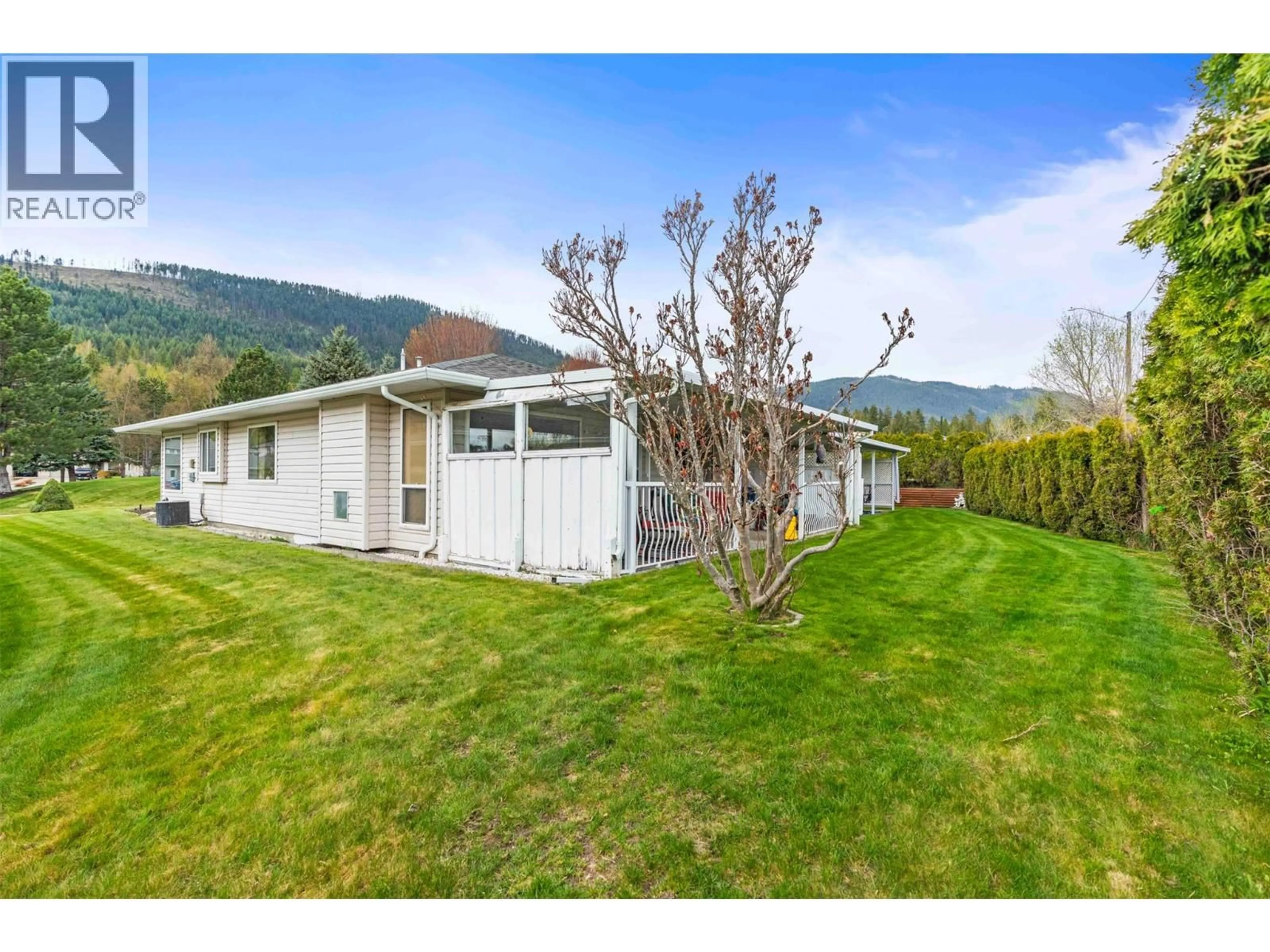 A pic from outside/outdoor area/front of a property/back of a property/a pic from drone, mountain view for 8 - 2675 PINE AVENUE, Lumby British Columbia V0E2G5