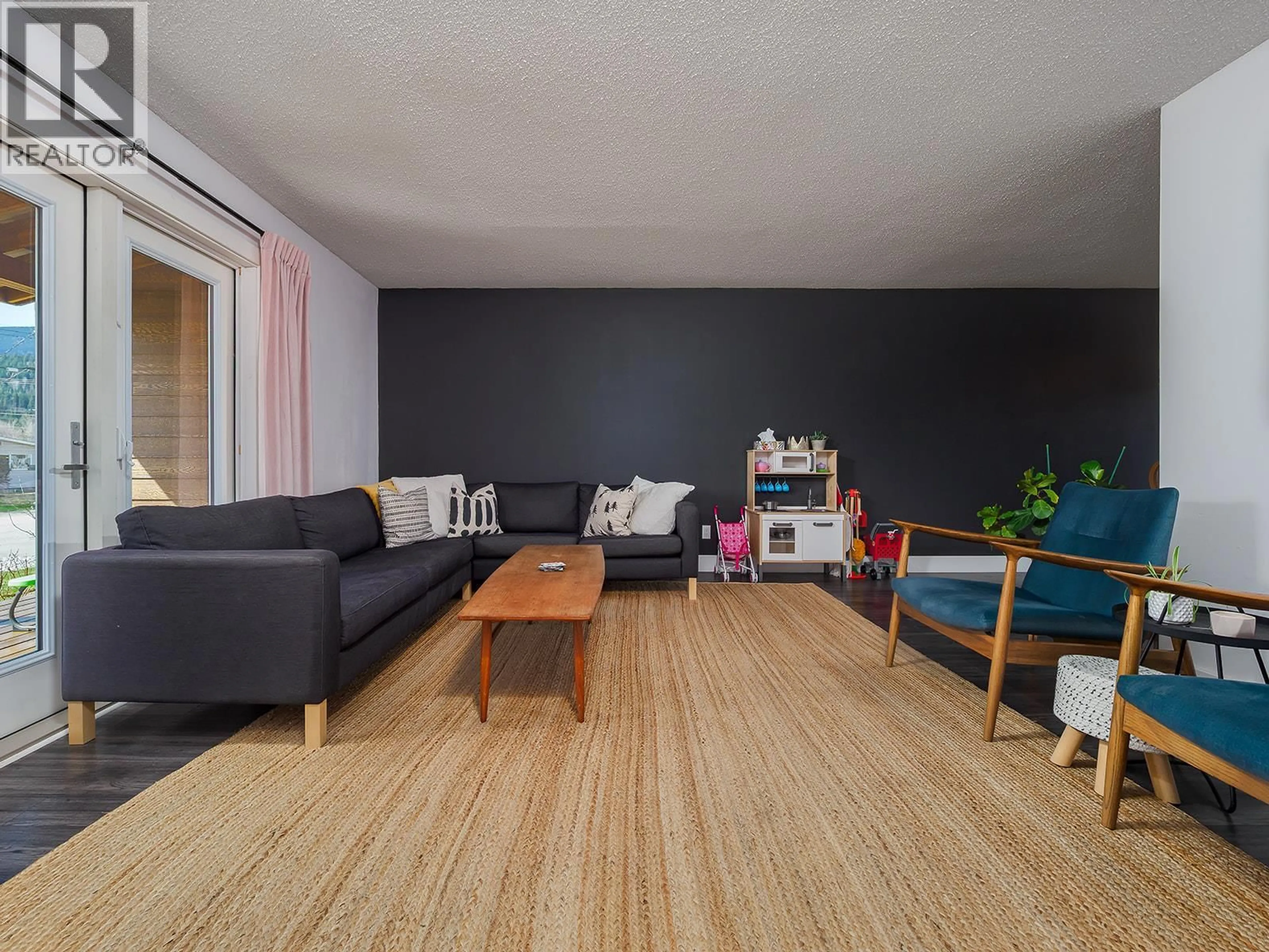 Living room with furniture, wood/laminate floor for 805 13TH STREET, Golden British Columbia V0A1H0