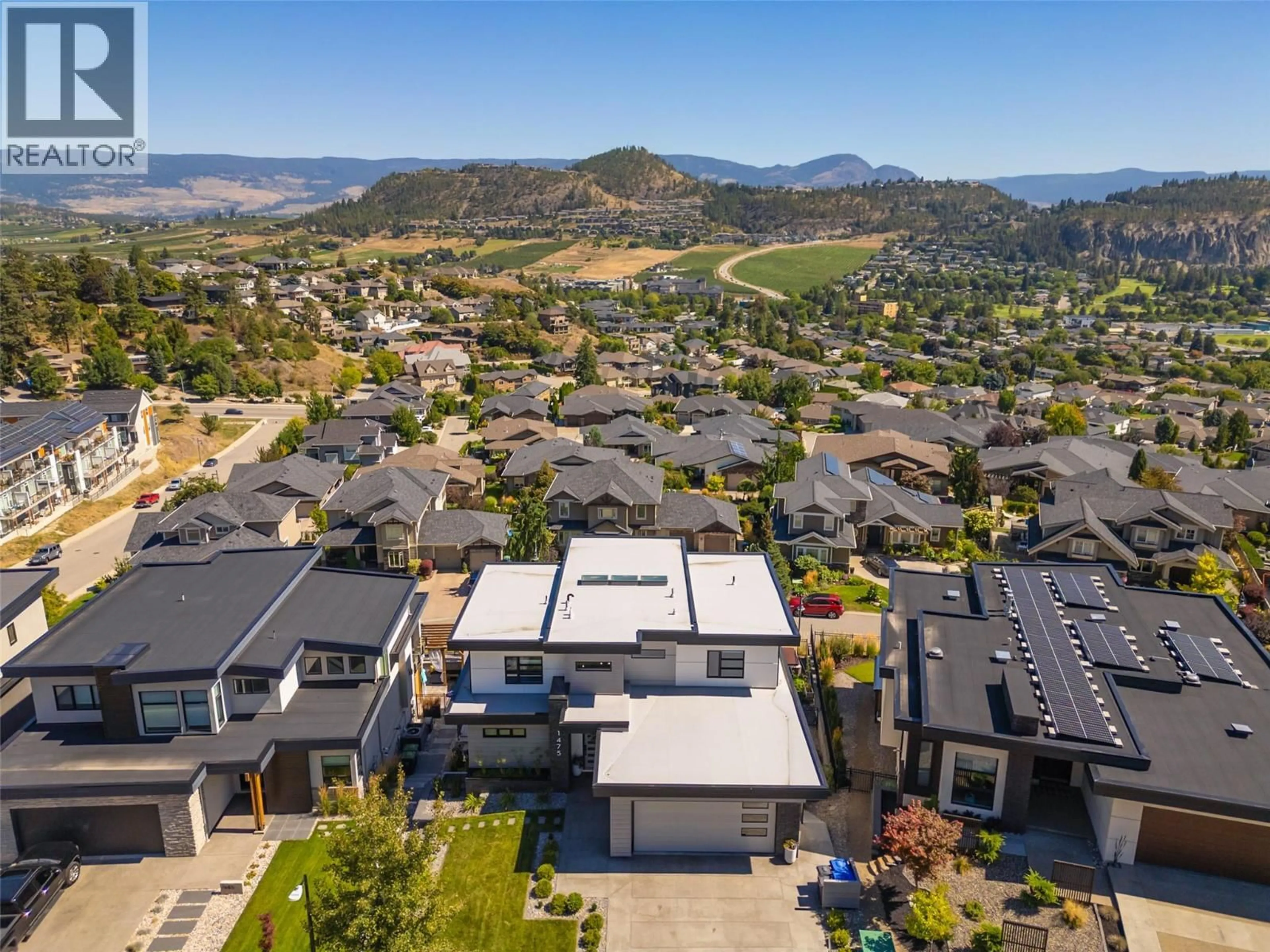 A pic from outside/outdoor area/front of a property/back of a property/a pic from drone, mountain view for 1475 BENZER COURT, Kelowna British Columbia V1V2Y1