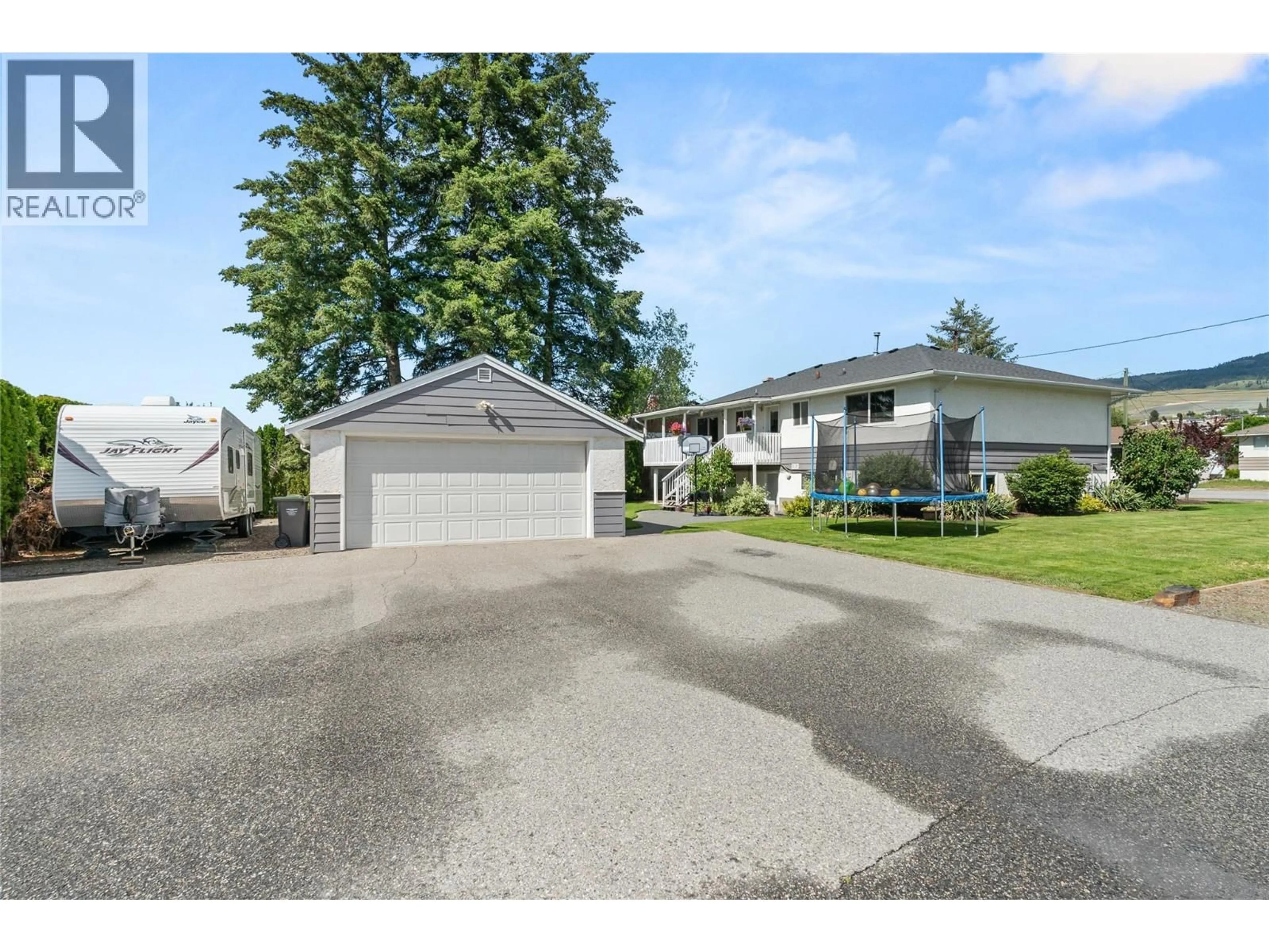 A pic from outside/outdoor area/front of a property/back of a property/a pic from drone, street for 260 GIBBS ROAD, Kelowna British Columbia V1X2W1