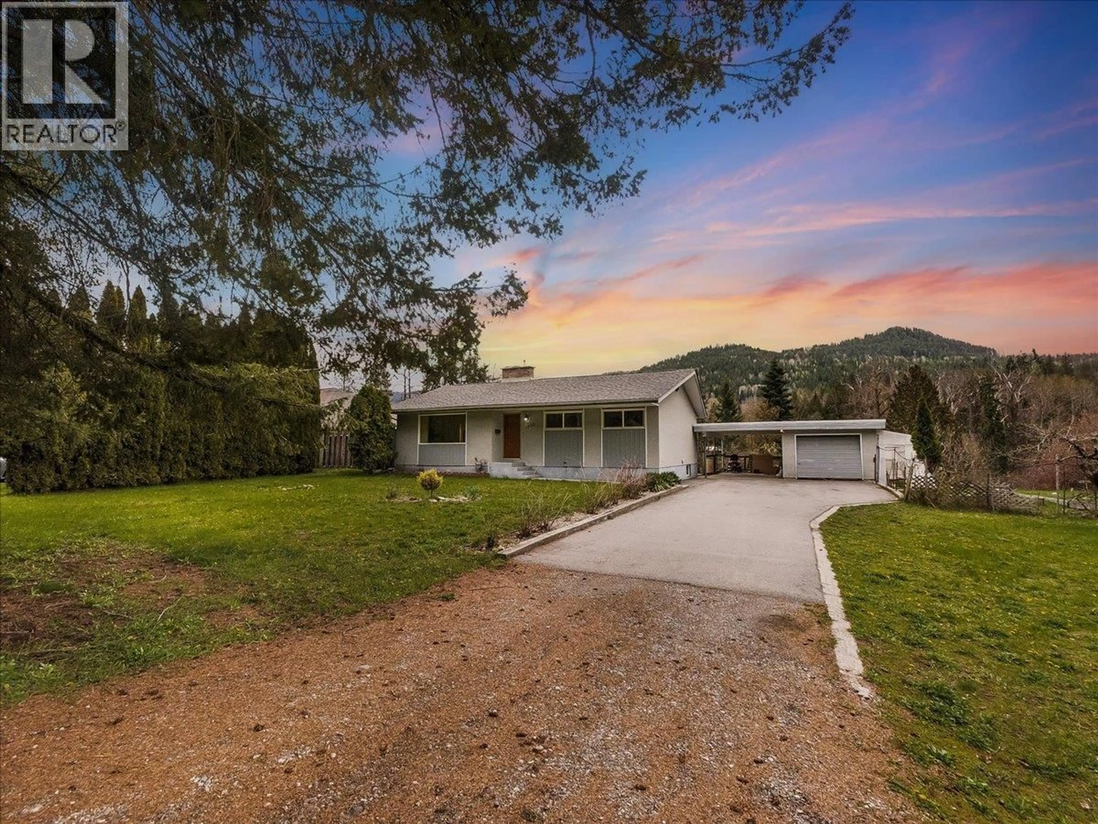 A pic from outside/outdoor area/front of a property/back of a property/a pic from drone, mountain view for 1500 3B HWY OTHER, Fruitvale British Columbia V0G1L1