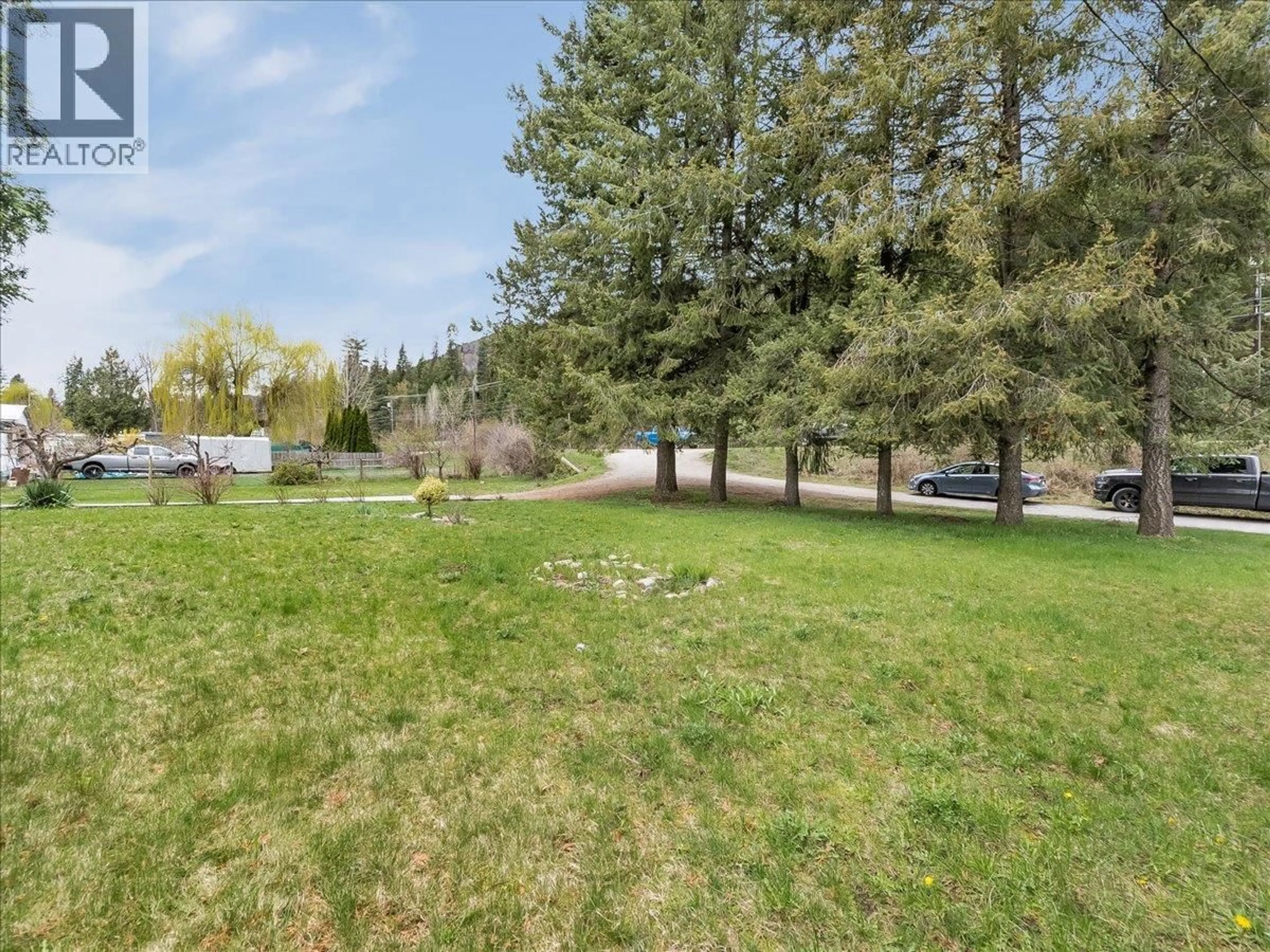 A pic from outside/outdoor area/front of a property/back of a property/a pic from drone, forest/trees view for 1500 3B HWY OTHER, Fruitvale British Columbia V0G1L1