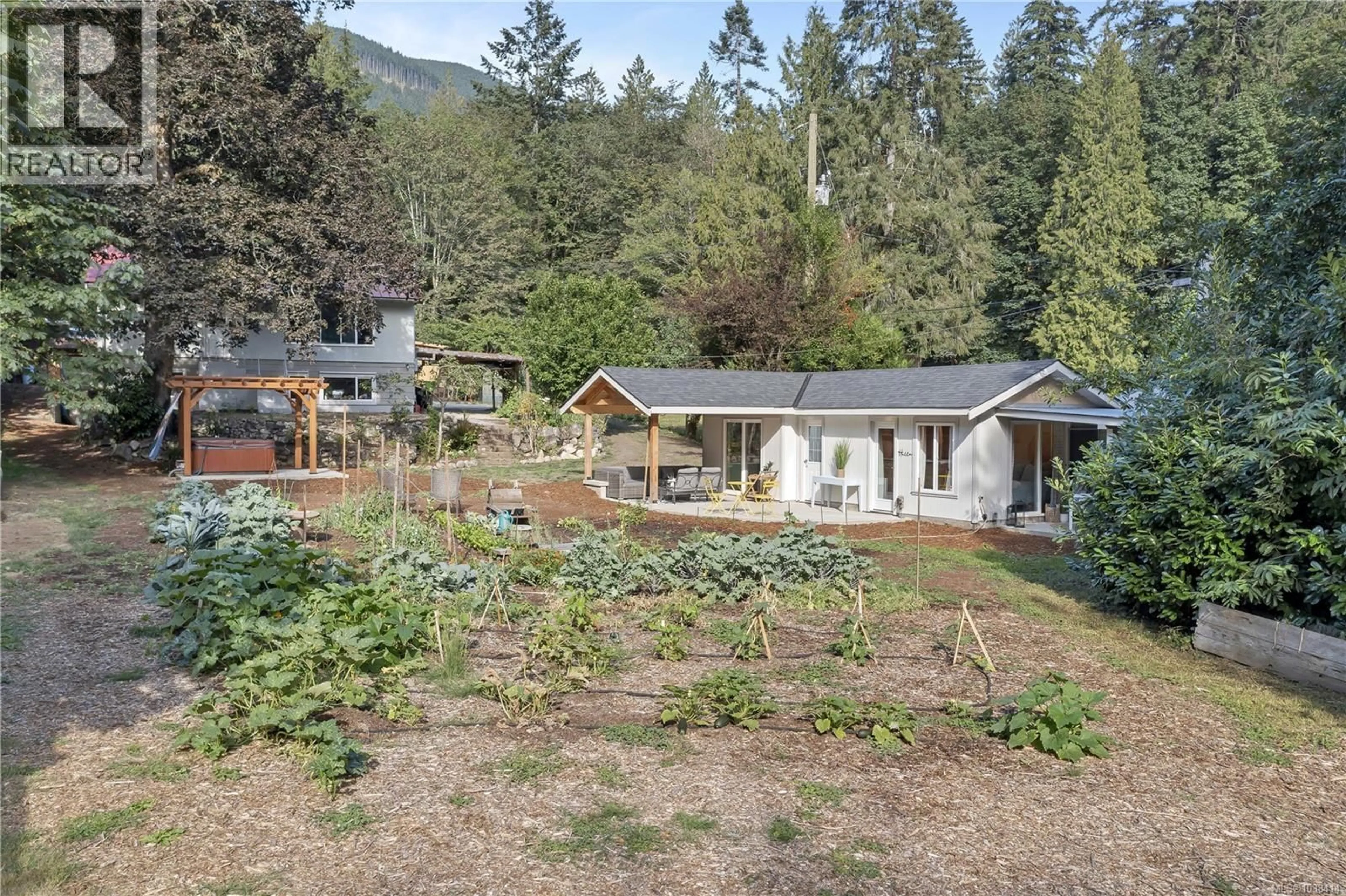 A pic from outside/outdoor area/front of a property/back of a property/a pic from drone, forest/trees view for 7840 WENTWORTH ROAD, Lake Cowichan British Columbia V0R2G0
