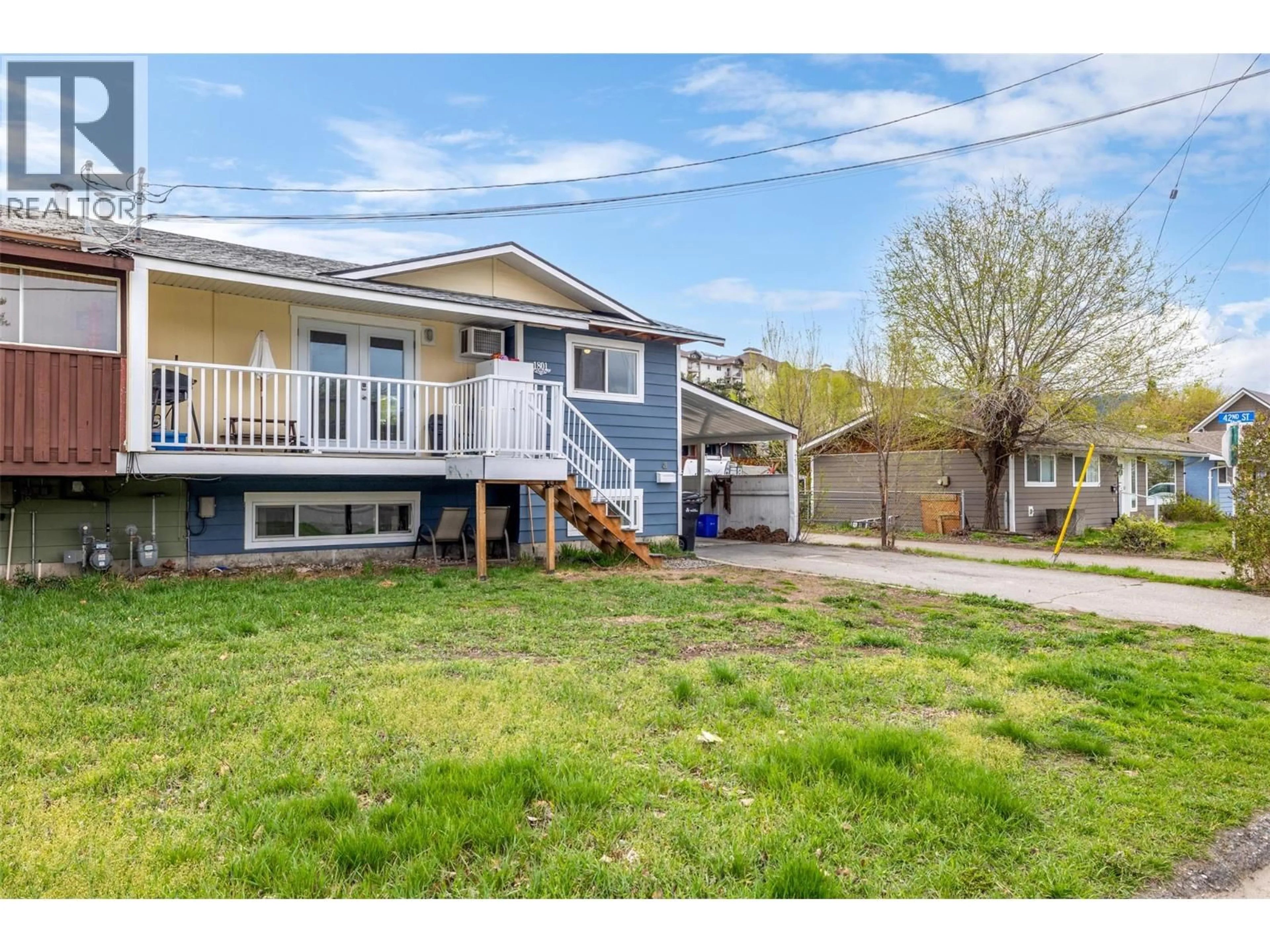 Home with vinyl exterior material, street for 1801 42A STREET, Vernon British Columbia V1T7H3