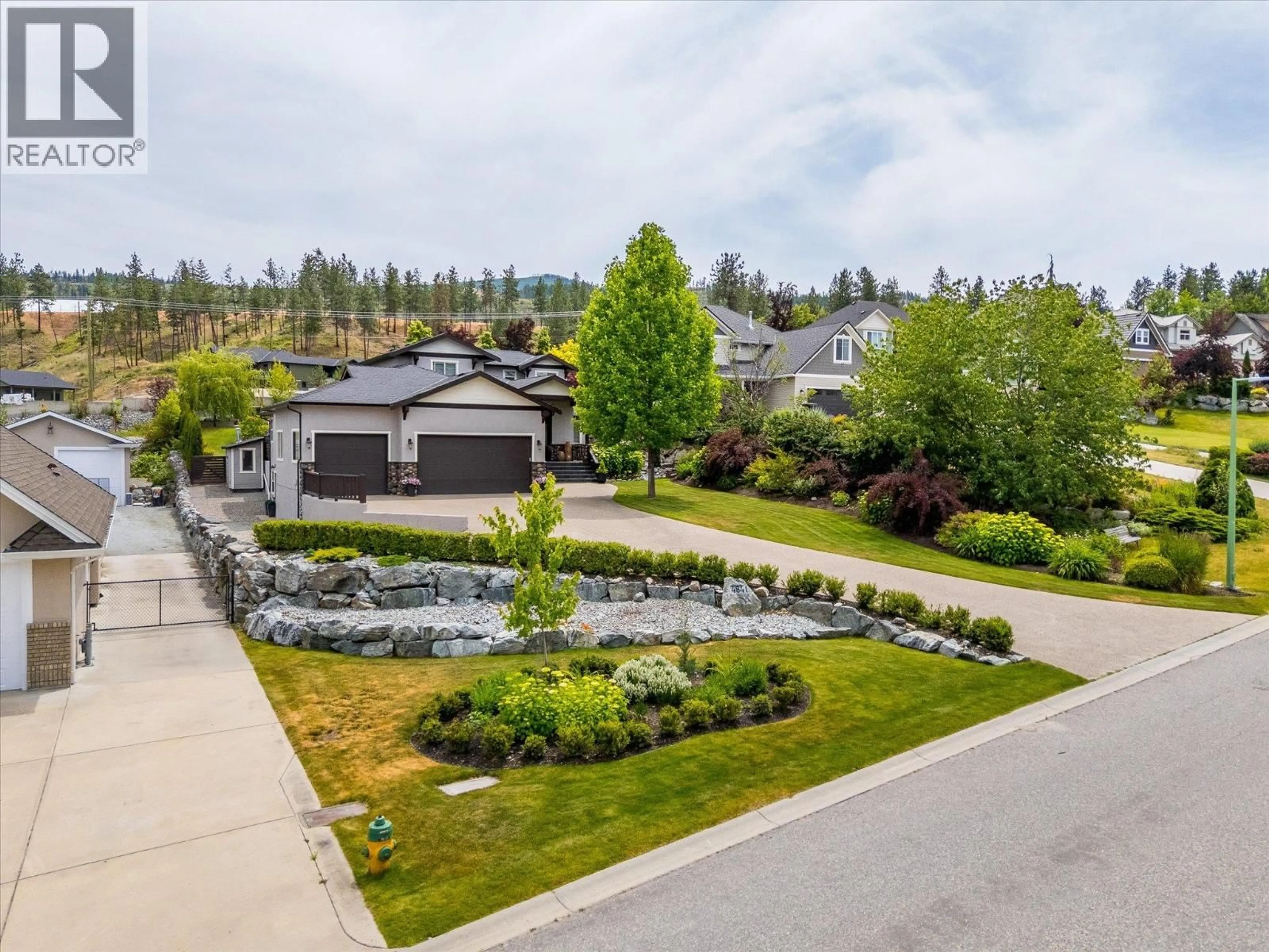A pic from outside/outdoor area/front of a property/back of a property/a pic from drone, street for 4841 CANYON RIDGE CRESCENT, Kelowna British Columbia V1W4A1
