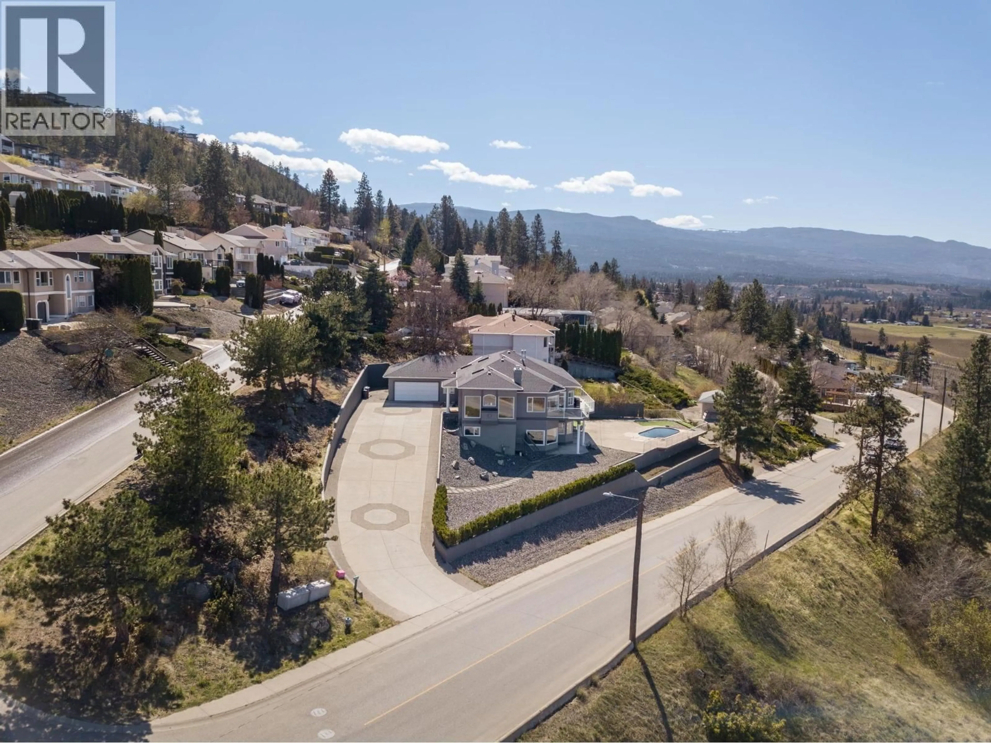 A pic from outside/outdoor area/front of a property/back of a property/a pic from drone, mountain view for 845 TOOVEY ROAD, Kelowna British Columbia V1X6P9