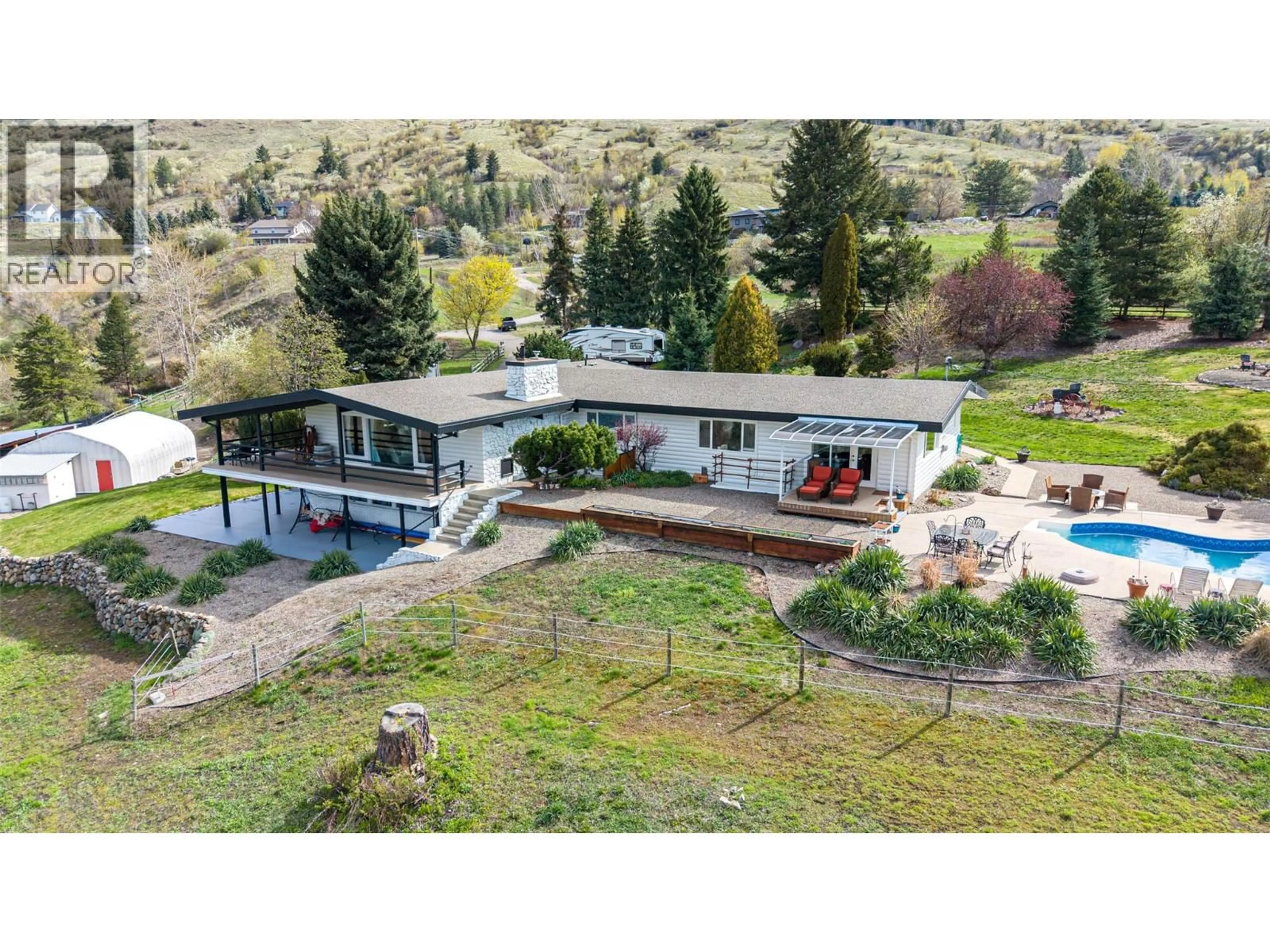 A pic from outside/outdoor area/front of a property/back of a property/a pic from drone, mountain view for 701 ROBIN ROAD, Vernon British Columbia V1B3B3