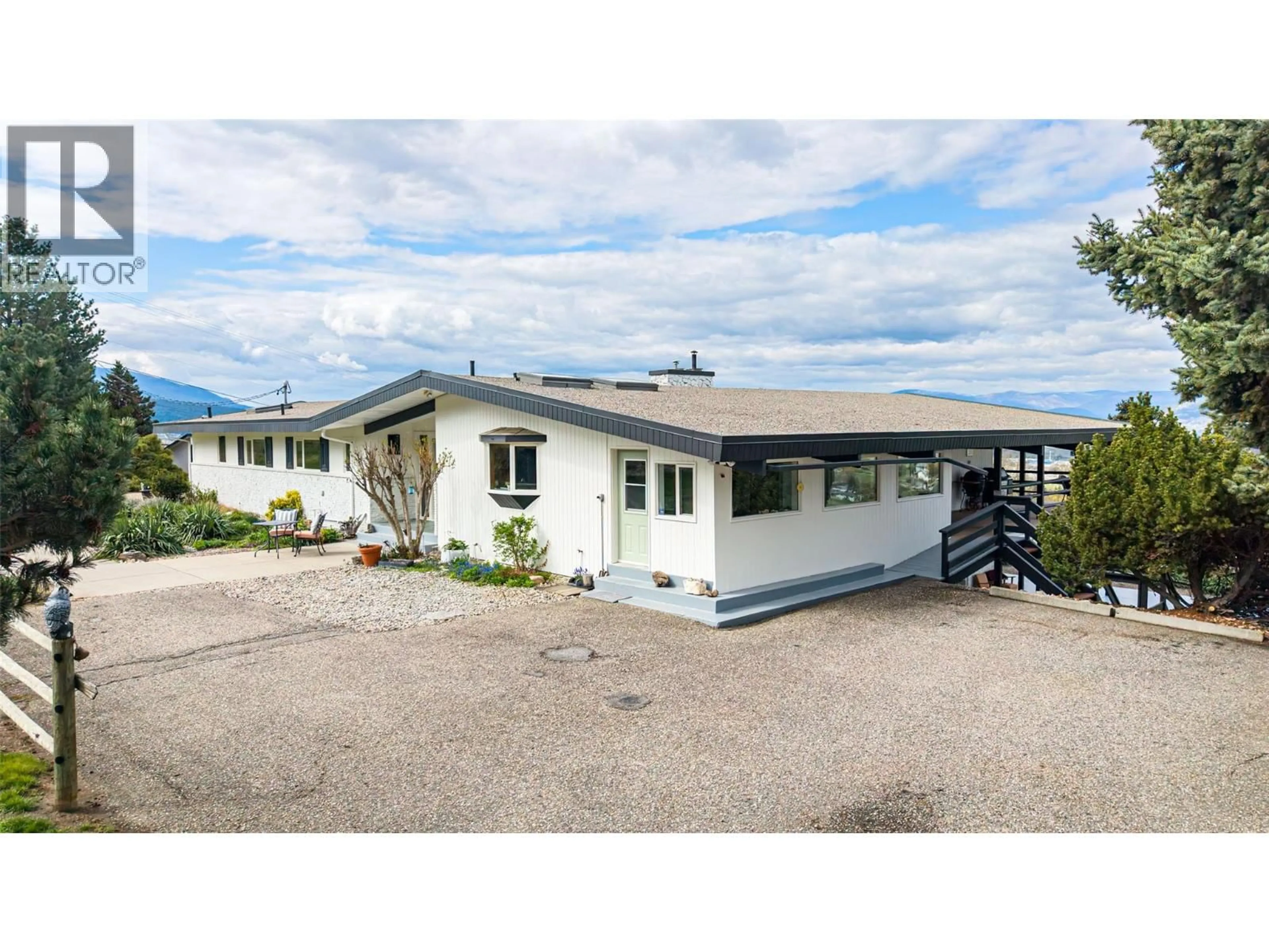 A pic from outside/outdoor area/front of a property/back of a property/a pic from drone, street for 701 ROBIN ROAD, Vernon British Columbia V1B3B3
