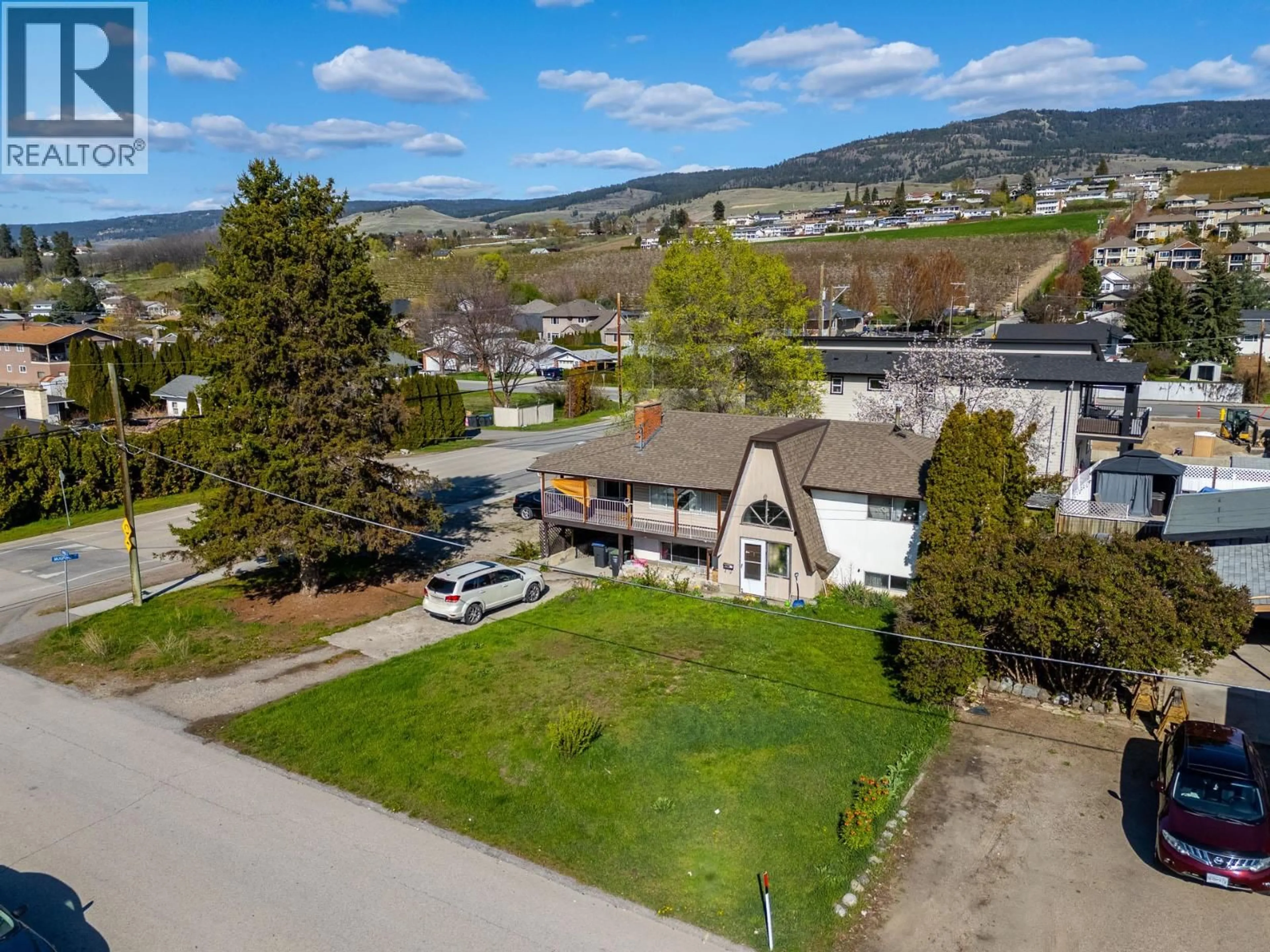 A pic from outside/outdoor area/front of a property/back of a property/a pic from drone, mountain view for 355 MARA ROAD, Kelowna British Columbia V1X2T1