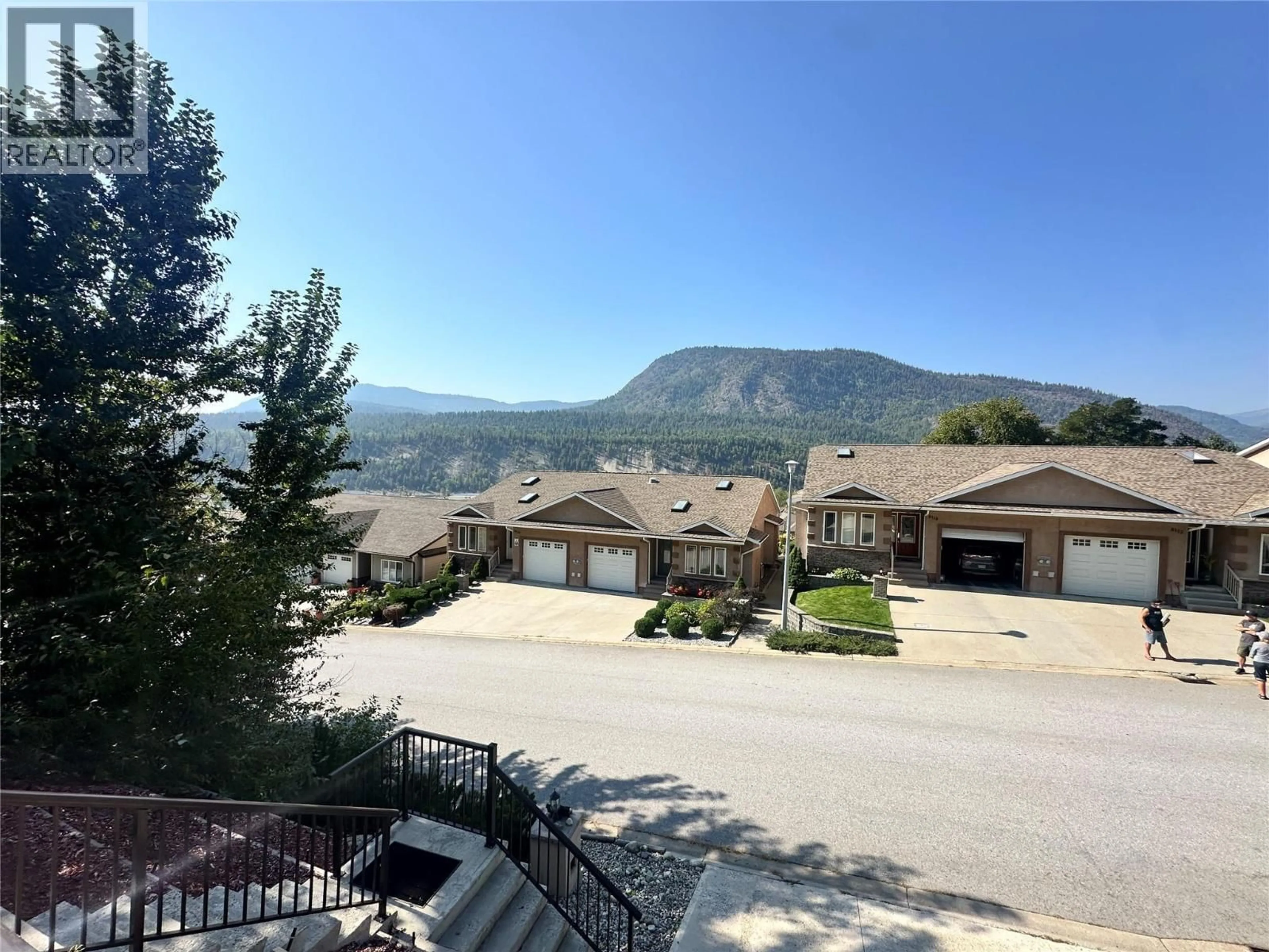 A pic from outside/outdoor area/front of a property/back of a property/a pic from drone, mountain view for 8121 BIRCHWOOD DRIVE, Trail British Columbia V1R4Y3