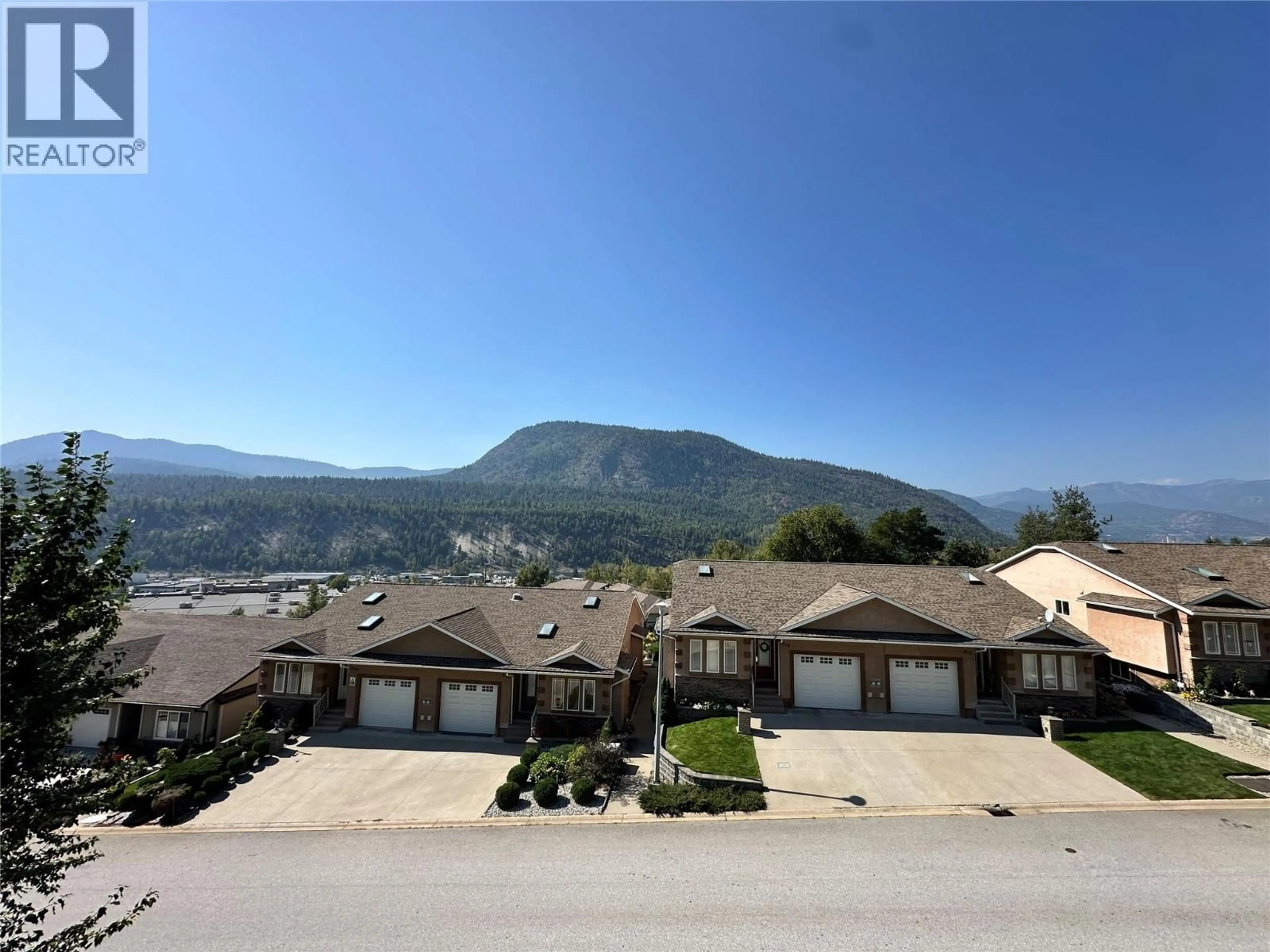 A pic from outside/outdoor area/front of a property/back of a property/a pic from drone, mountain view for 8121 BIRCHWOOD DRIVE, Trail British Columbia V1R4Y3