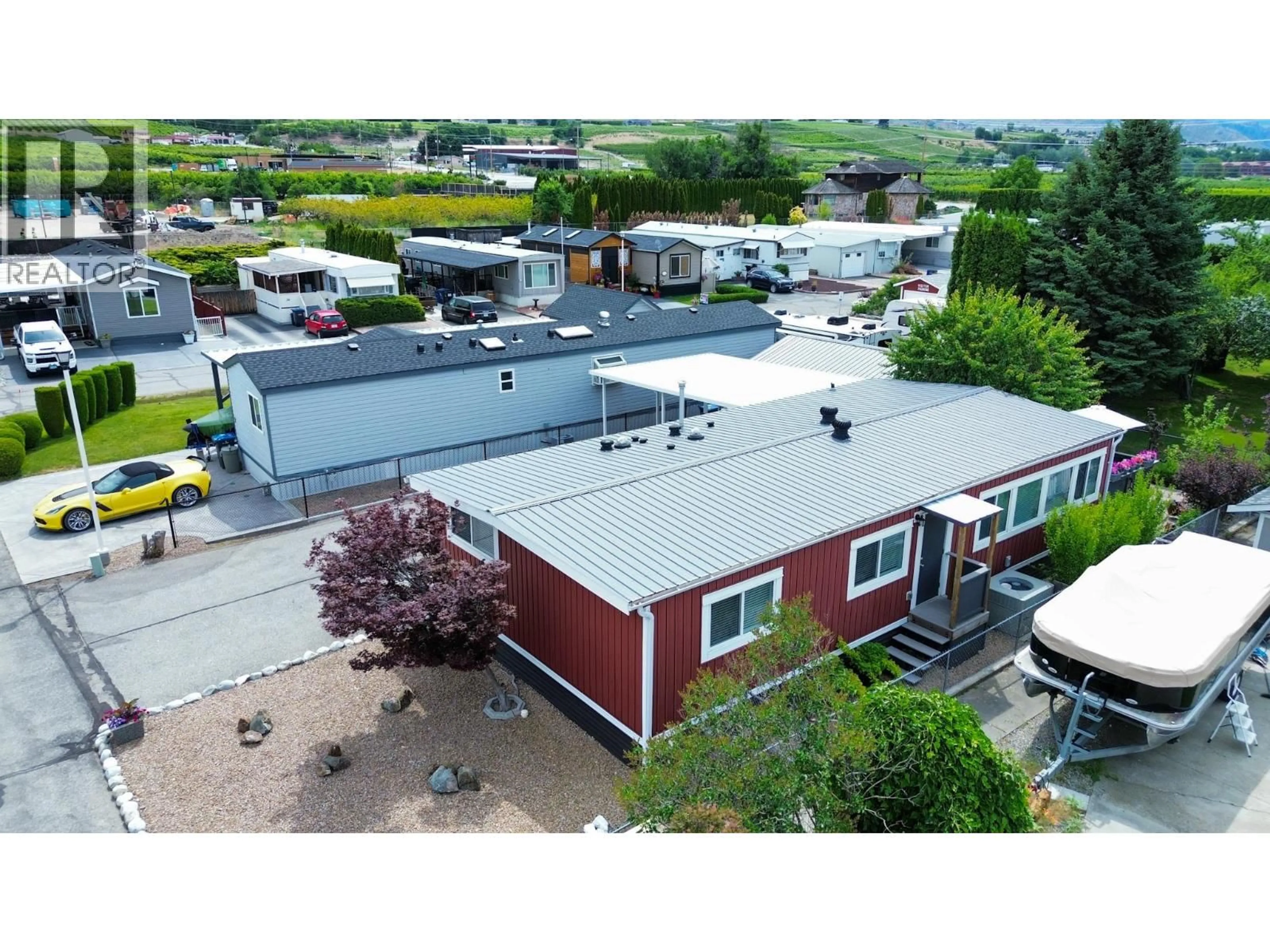 A pic from outside/outdoor area/front of a property/back of a property/a pic from drone, building for 8 - 4911 CEDAR LANE, Osoyoos British Columbia V0H1V3