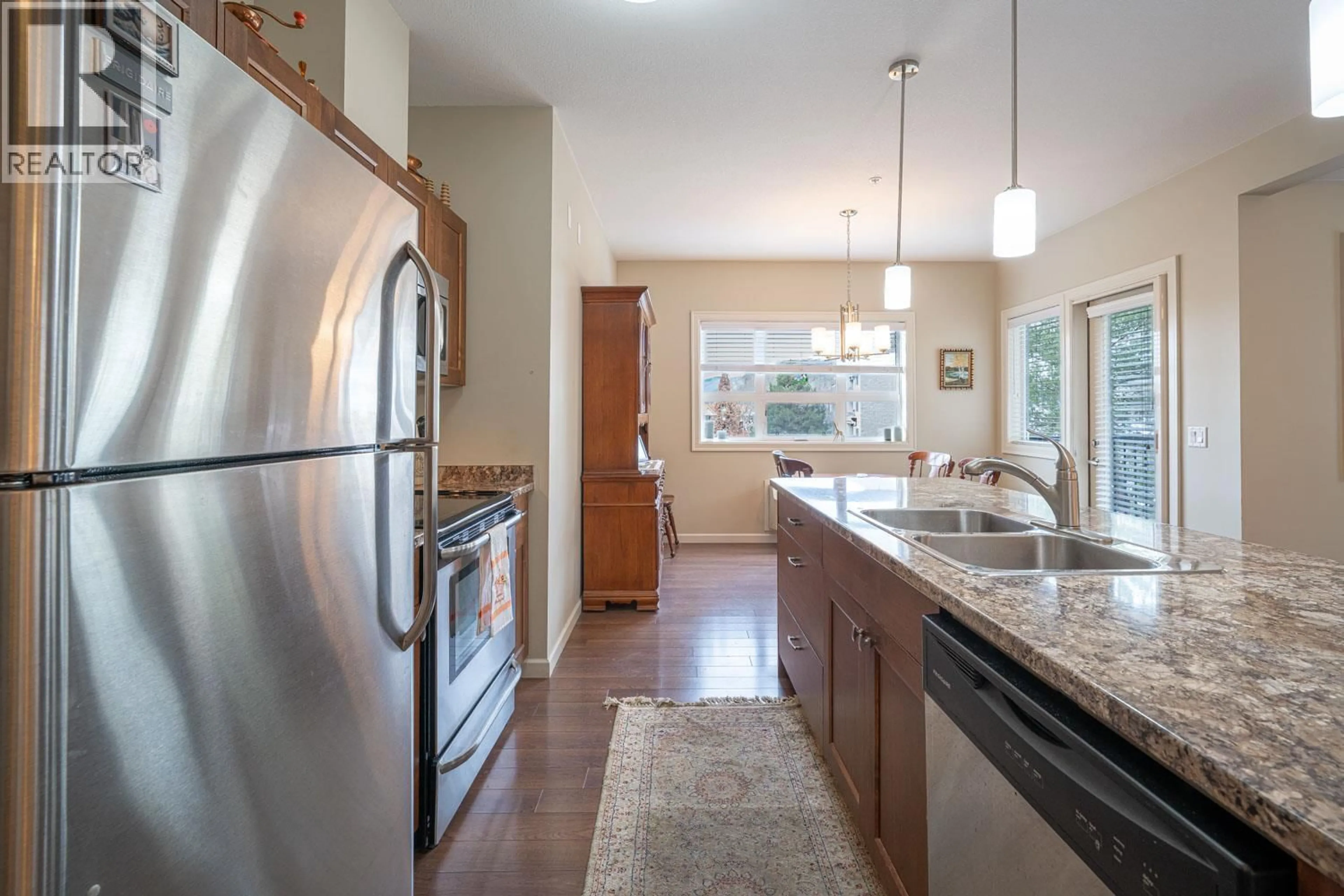 Open concept kitchen, ceramic/tile floor for 103 - 3010 35TH STREET, Vernon British Columbia V1T0A7