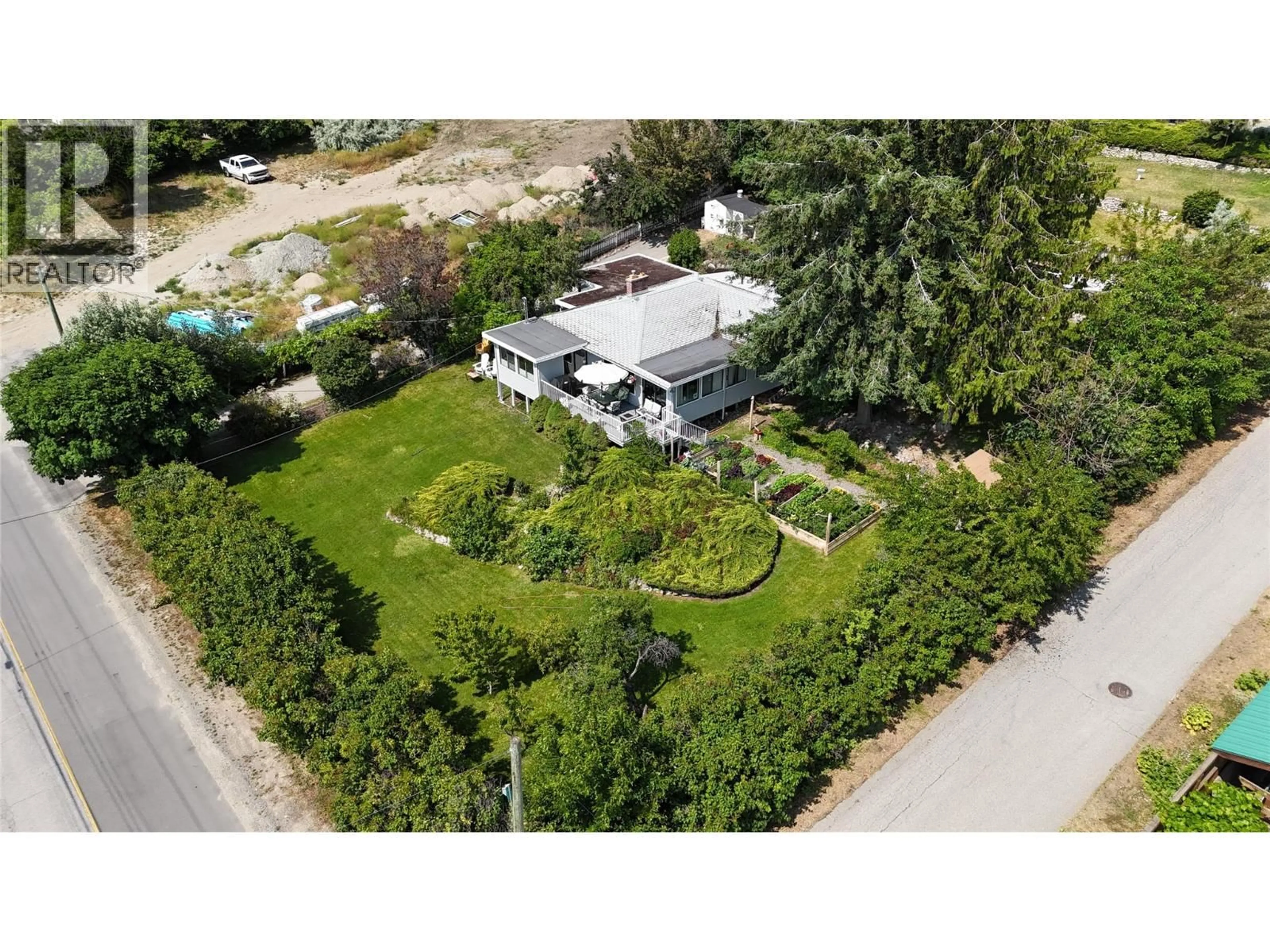 A pic from outside/outdoor area/front of a property/back of a property/a pic from drone, street for 5286 BUCHANAN ROAD, Peachland British Columbia V0H1X1