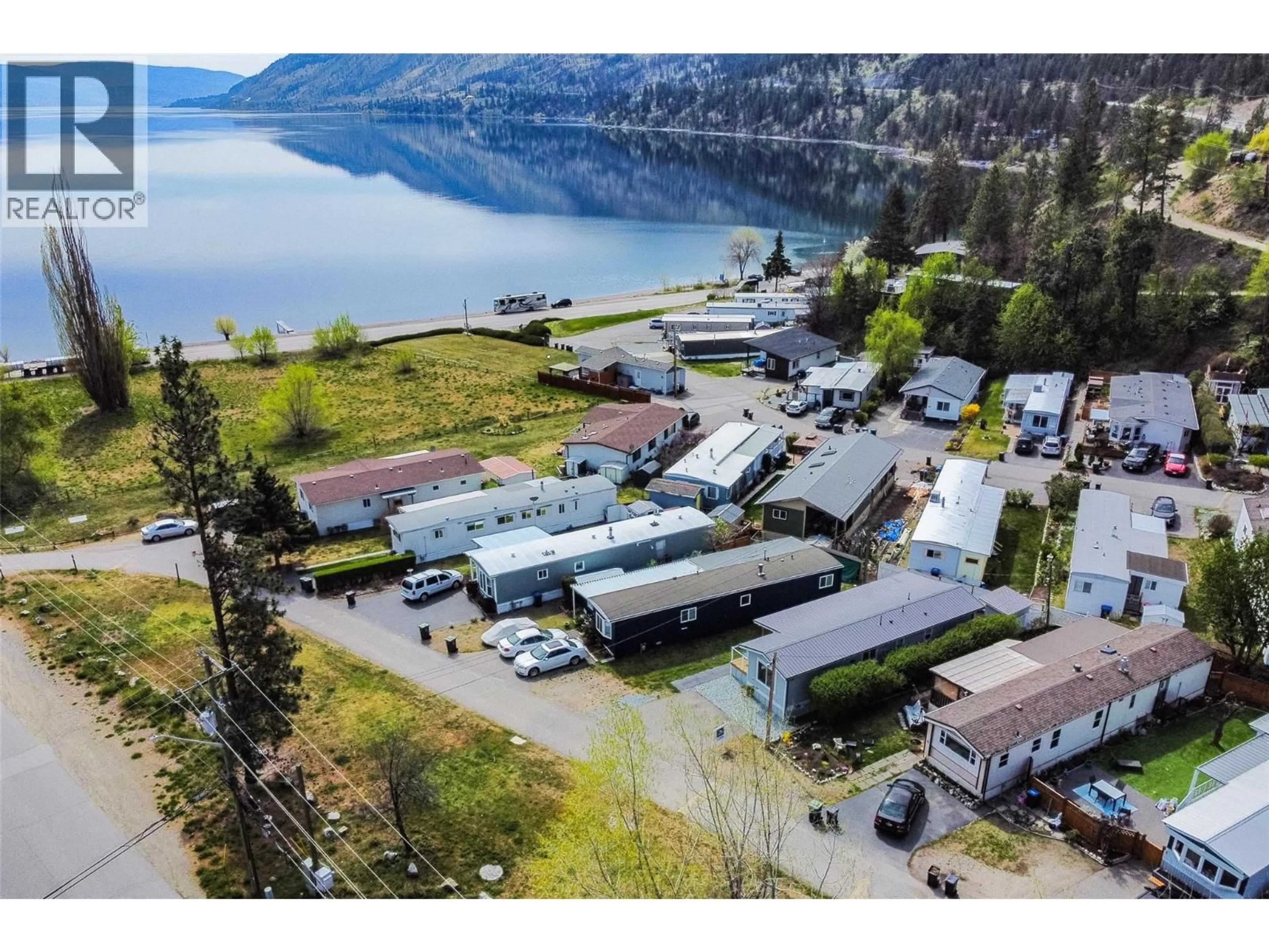 A pic from outside/outdoor area/front of a property/back of a property/a pic from drone, water/lake/river/ocean view for 5 - 6711 HWY 97 SOUTH HIGHWAY, Peachland British Columbia V0H1X9
