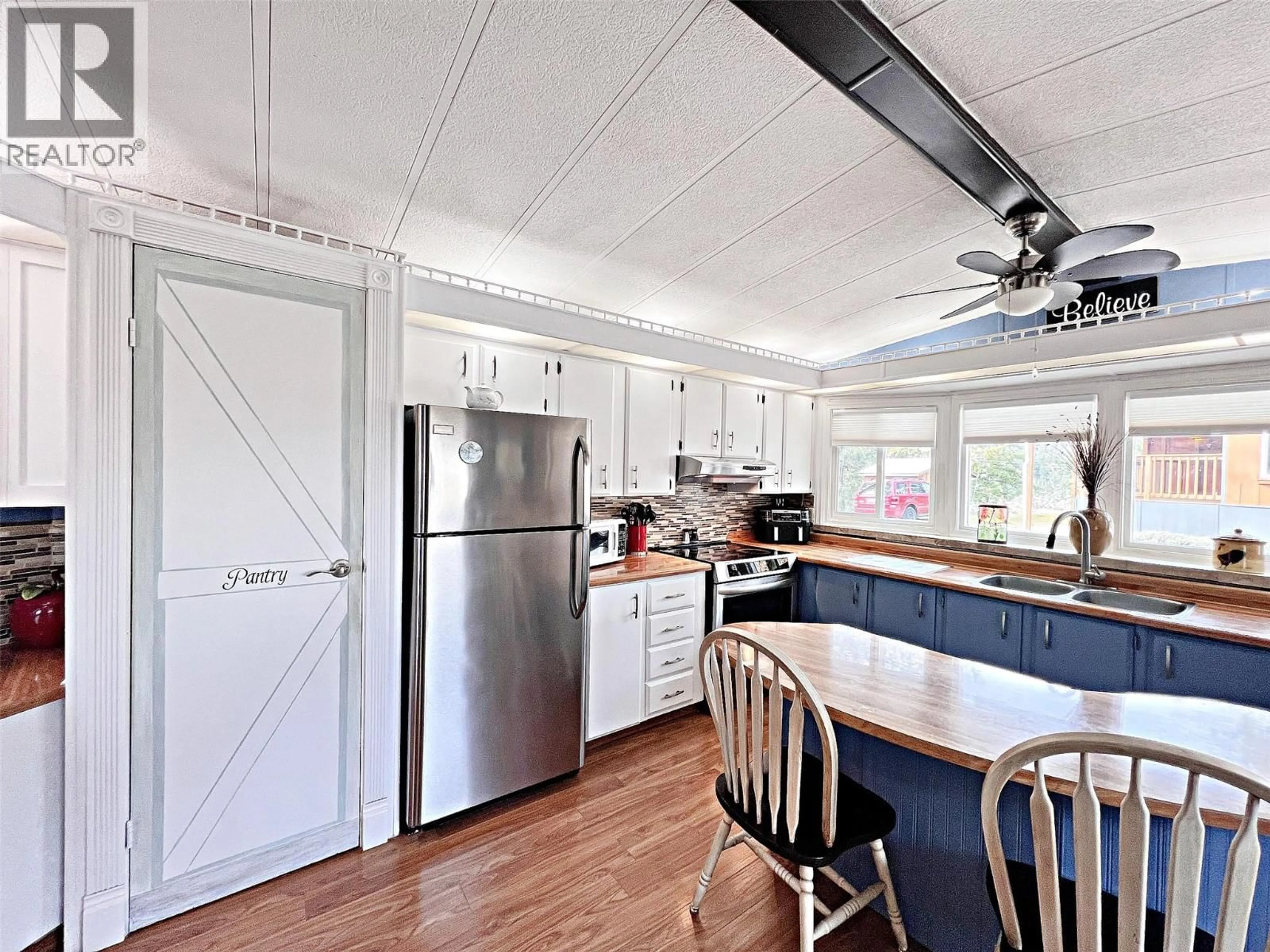 Open concept kitchen, wood/laminate floor for 11 - 5371 PRINCETON AVENUE, Peachland British Columbia V0H1X8