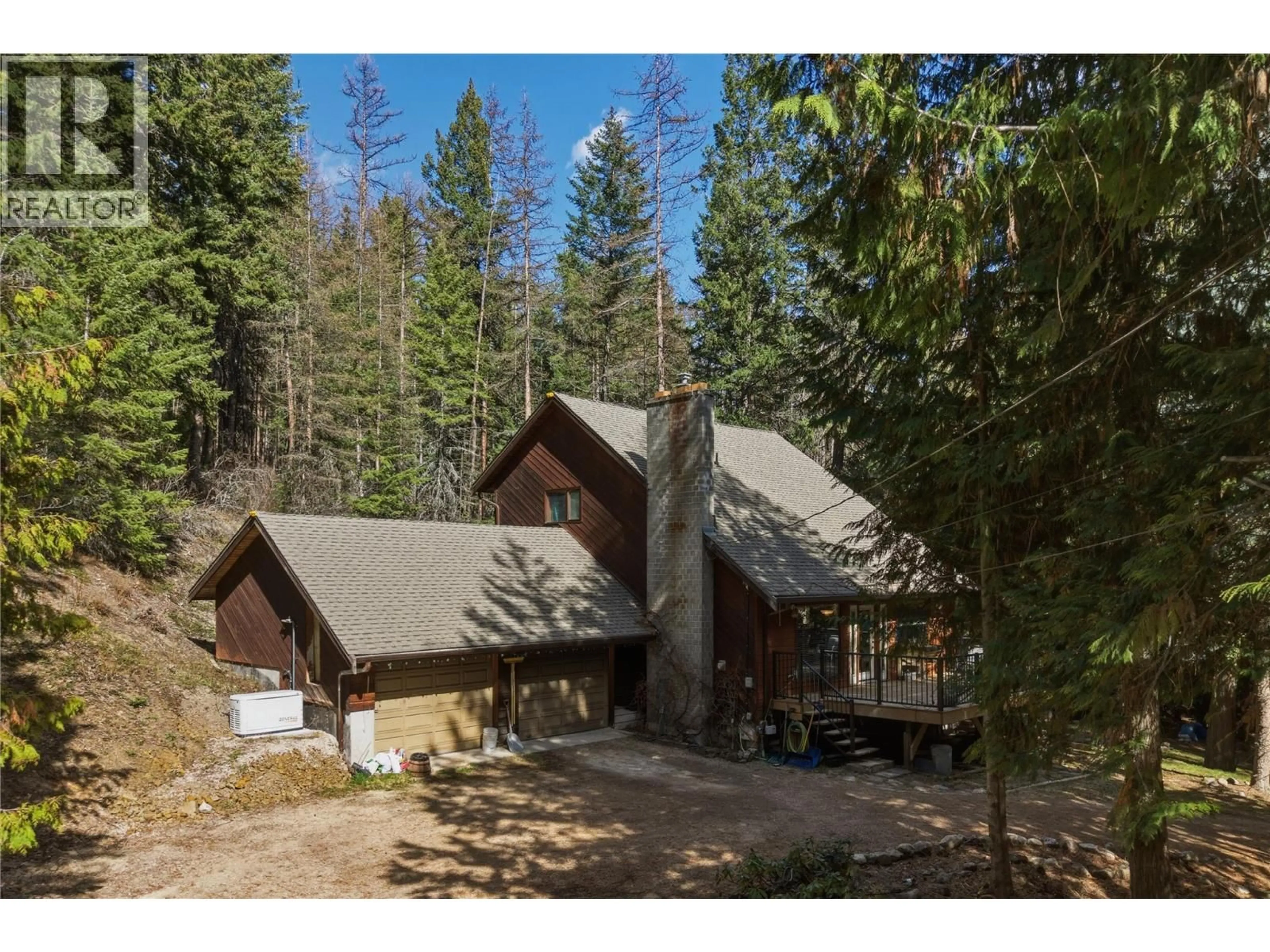 A pic from outside/outdoor area/front of a property/back of a property/a pic from drone, forest/trees view for 8257 ROGERS ROAD, Vernon British Columbia V1B3M7