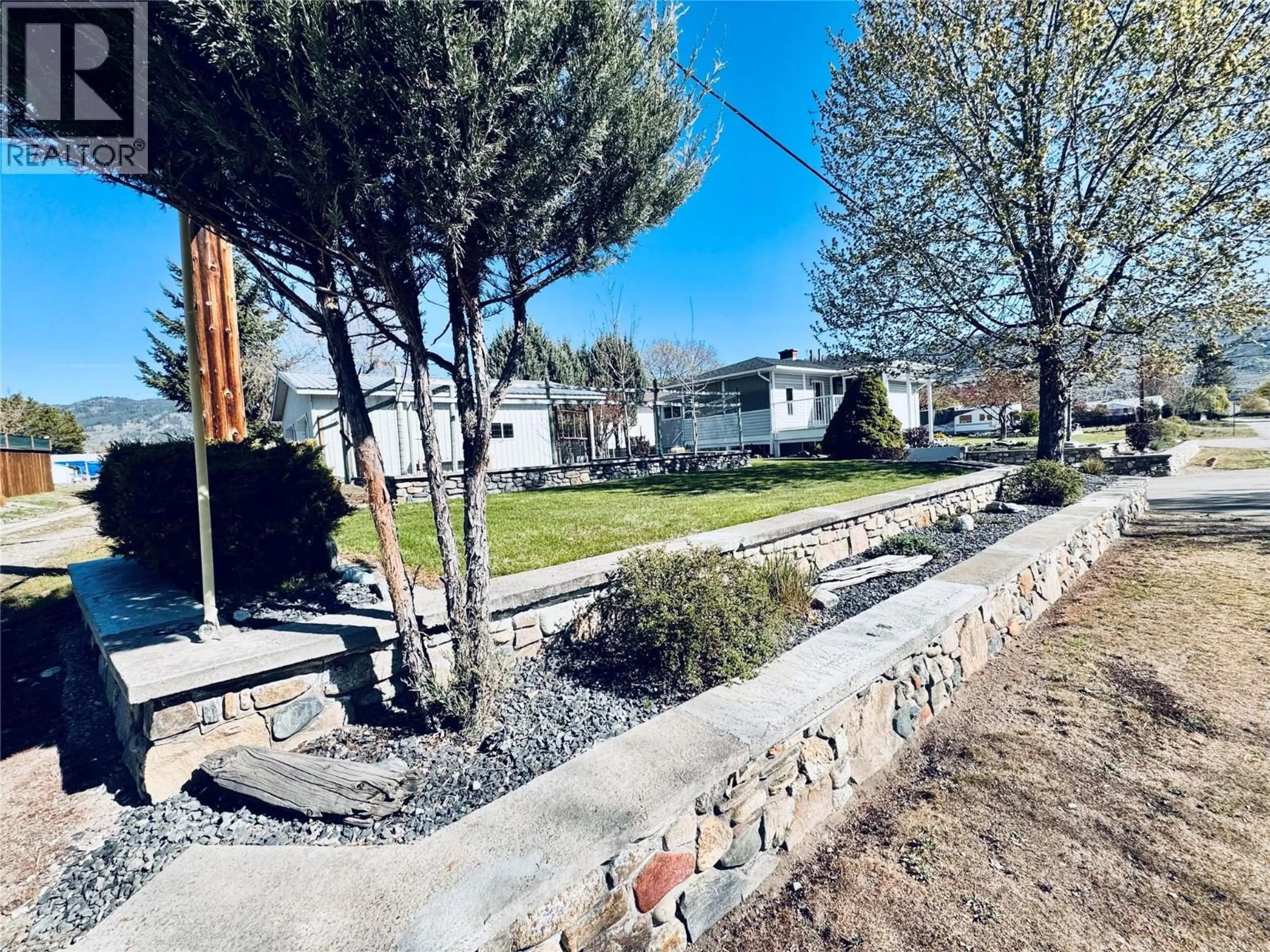 A pic from outside/outdoor area/front of a property/back of a property/a pic from drone, street for 7027 18TH STREET, Grand Forks British Columbia V0H1H2