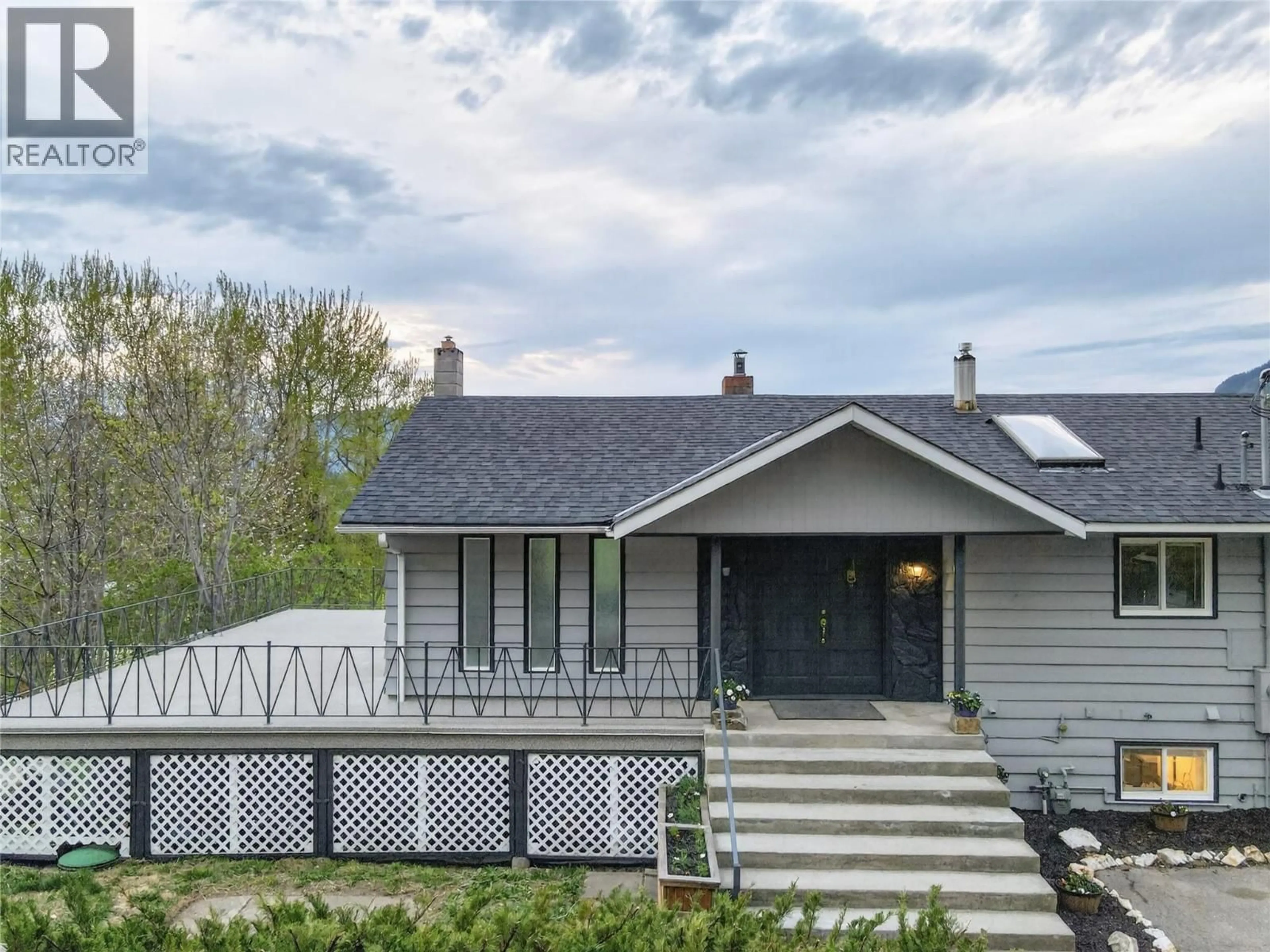 Home with vinyl exterior material, street for 6990 70 AVENUE NORTHEAST, Salmon Arm British Columbia V0E1K0