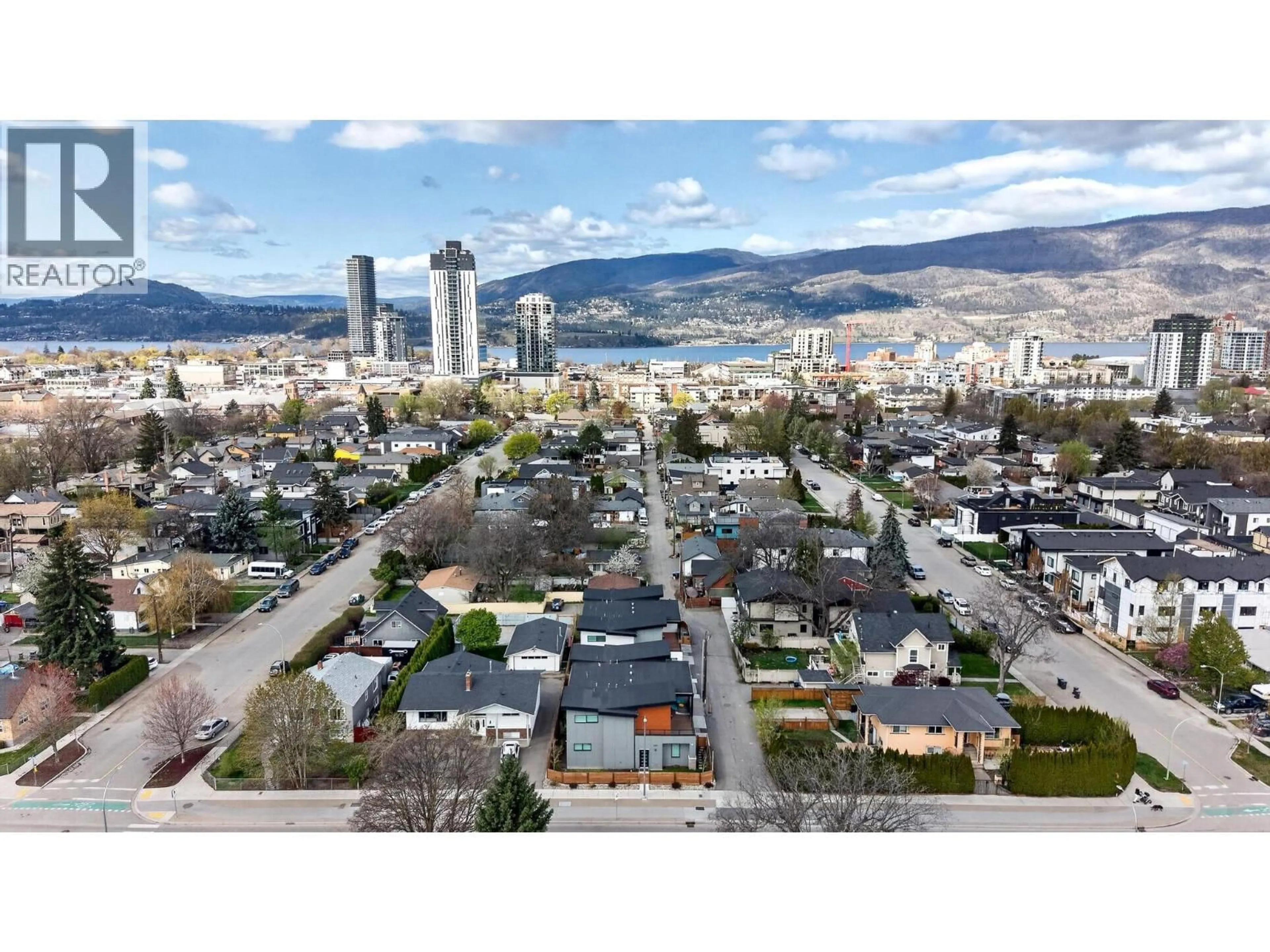 A pic from outside/outdoor area/front of a property/back of a property/a pic from drone, mountain view for 1 - 1452 ETHEL STREET, Kelowna British Columbia V1Y2Z7