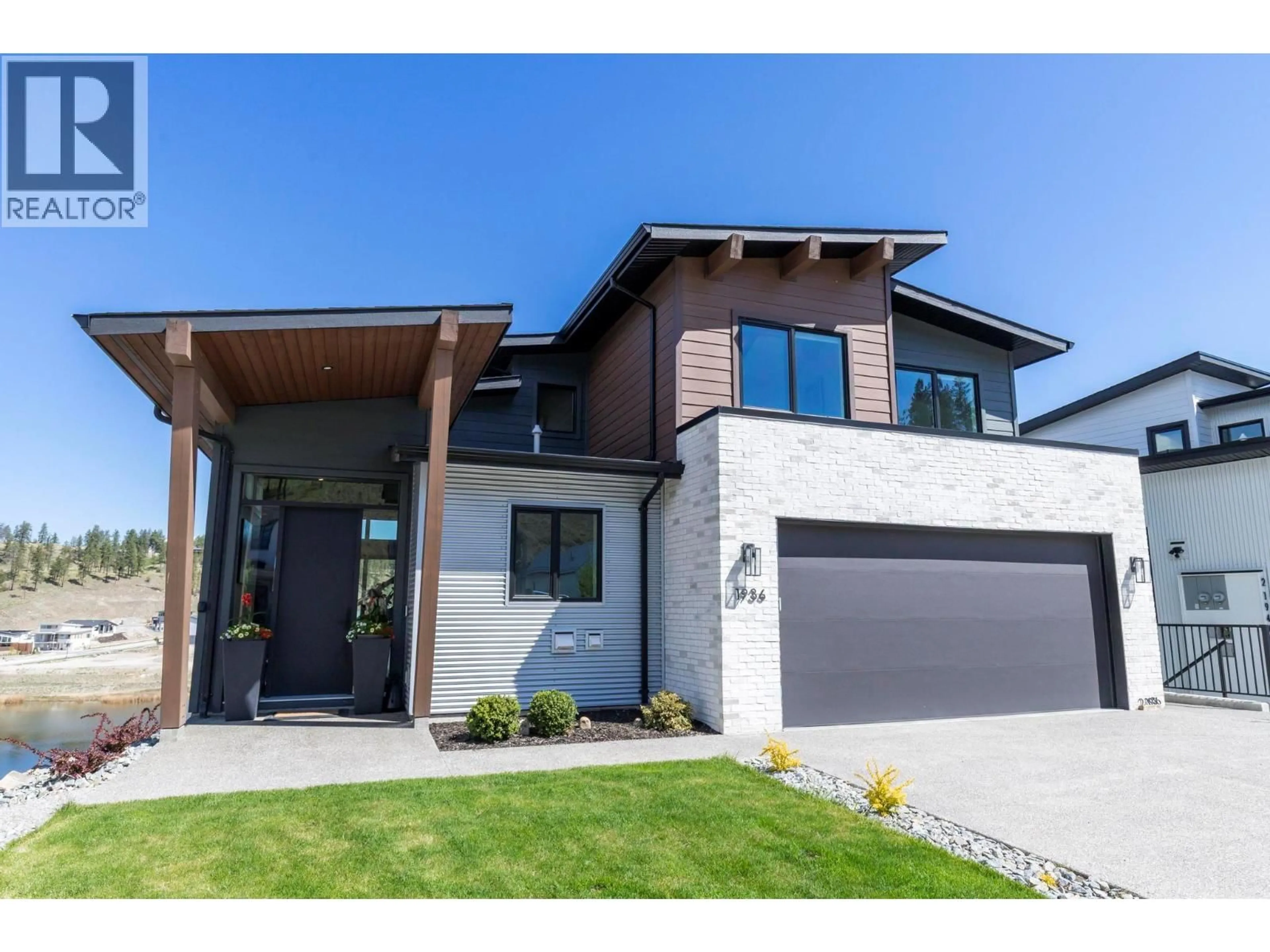 Home with brick exterior material, street for 1936 NORTHERN FLICKER COURT, Kelowna British Columbia V1V0G3