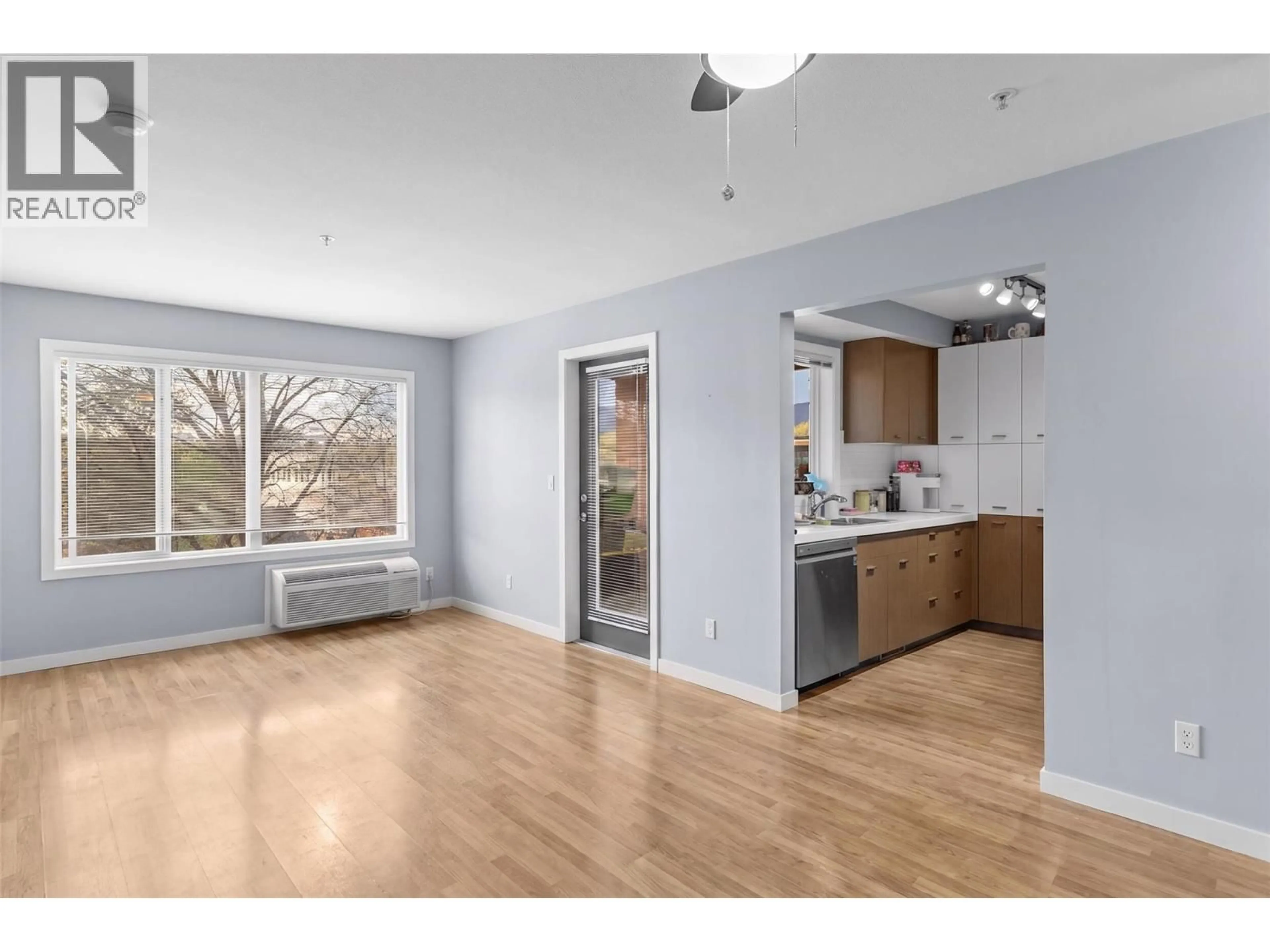 Open concept kitchen, wood/laminate floor for 222 - 1550 DICKSON AVENUE, Kelowna British Columbia V1Y9Y8