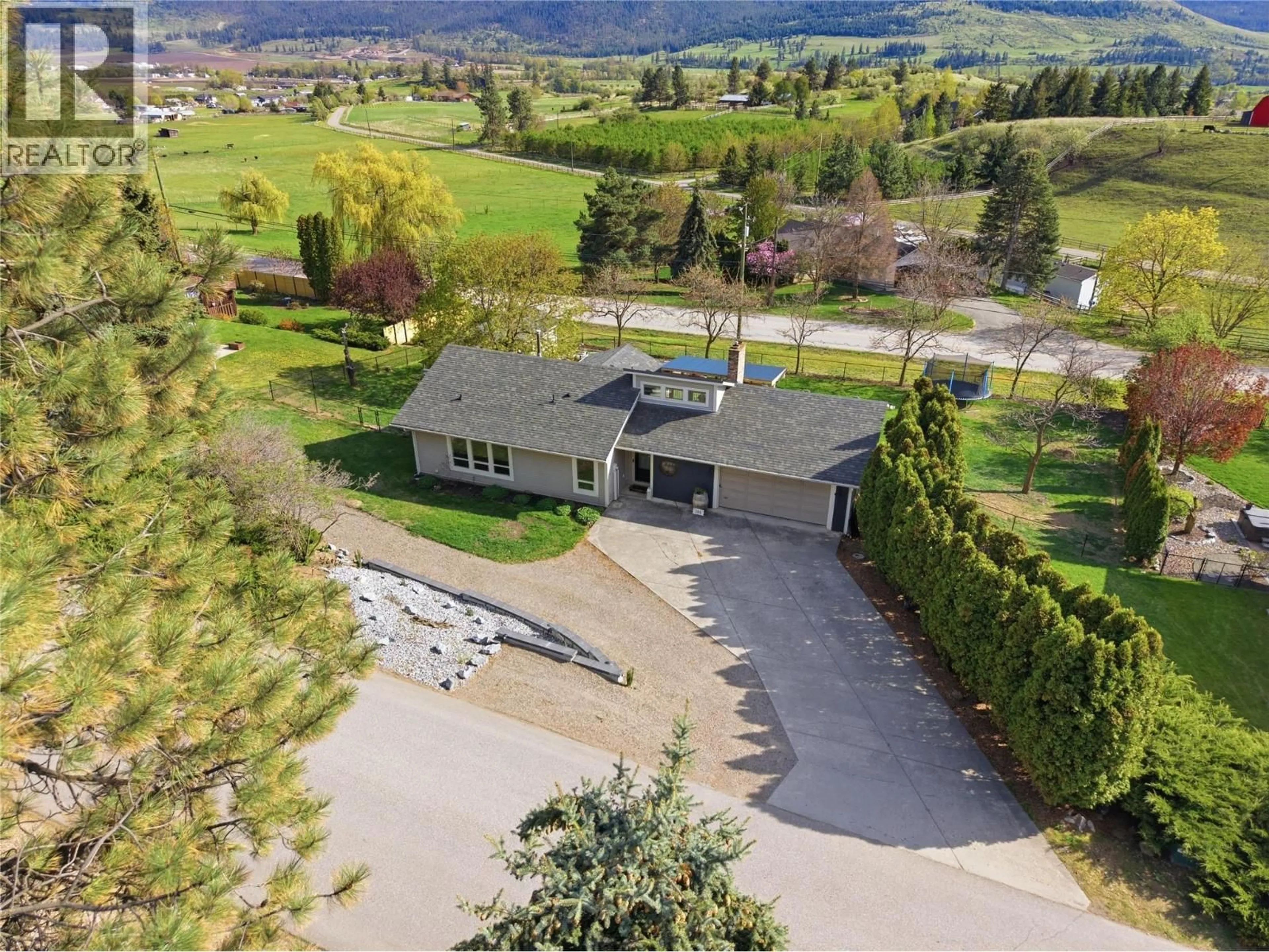 A pic from outside/outdoor area/front of a property/back of a property/a pic from drone, mountain view for 300 SCENIC DRIVE, Coldstream British Columbia V1B2X3