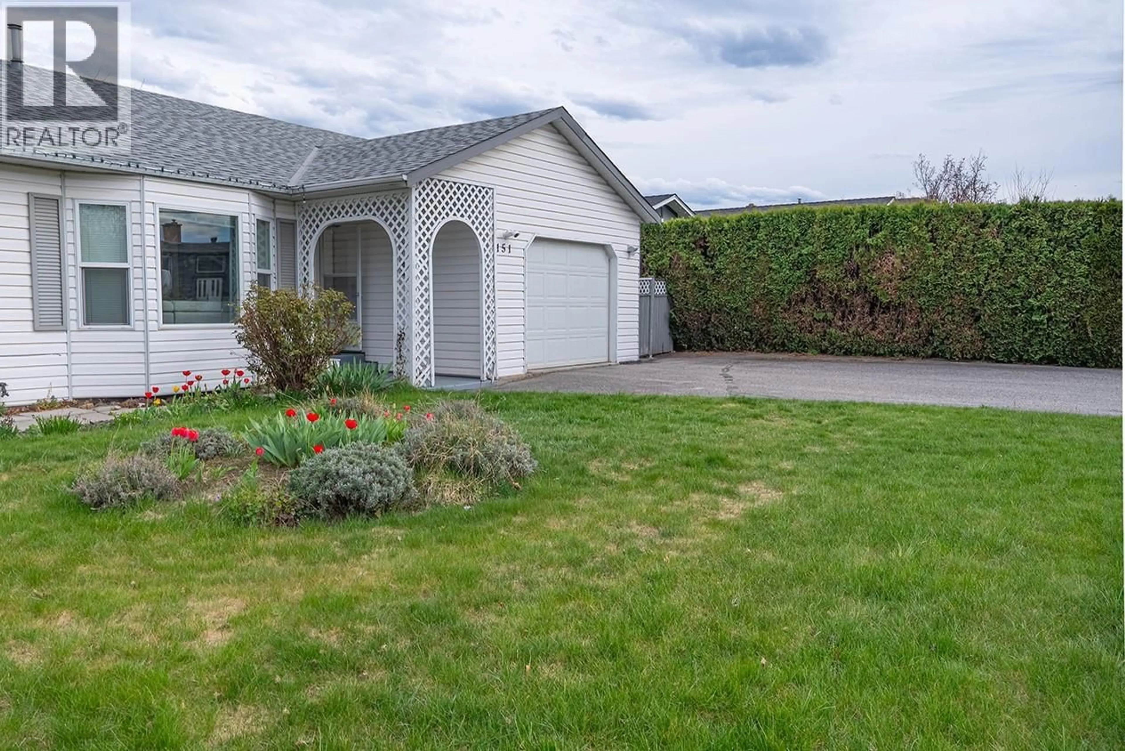 Home with vinyl exterior material, street for 151 MOLNAR ROAD, Kelowna British Columbia V1X7B5